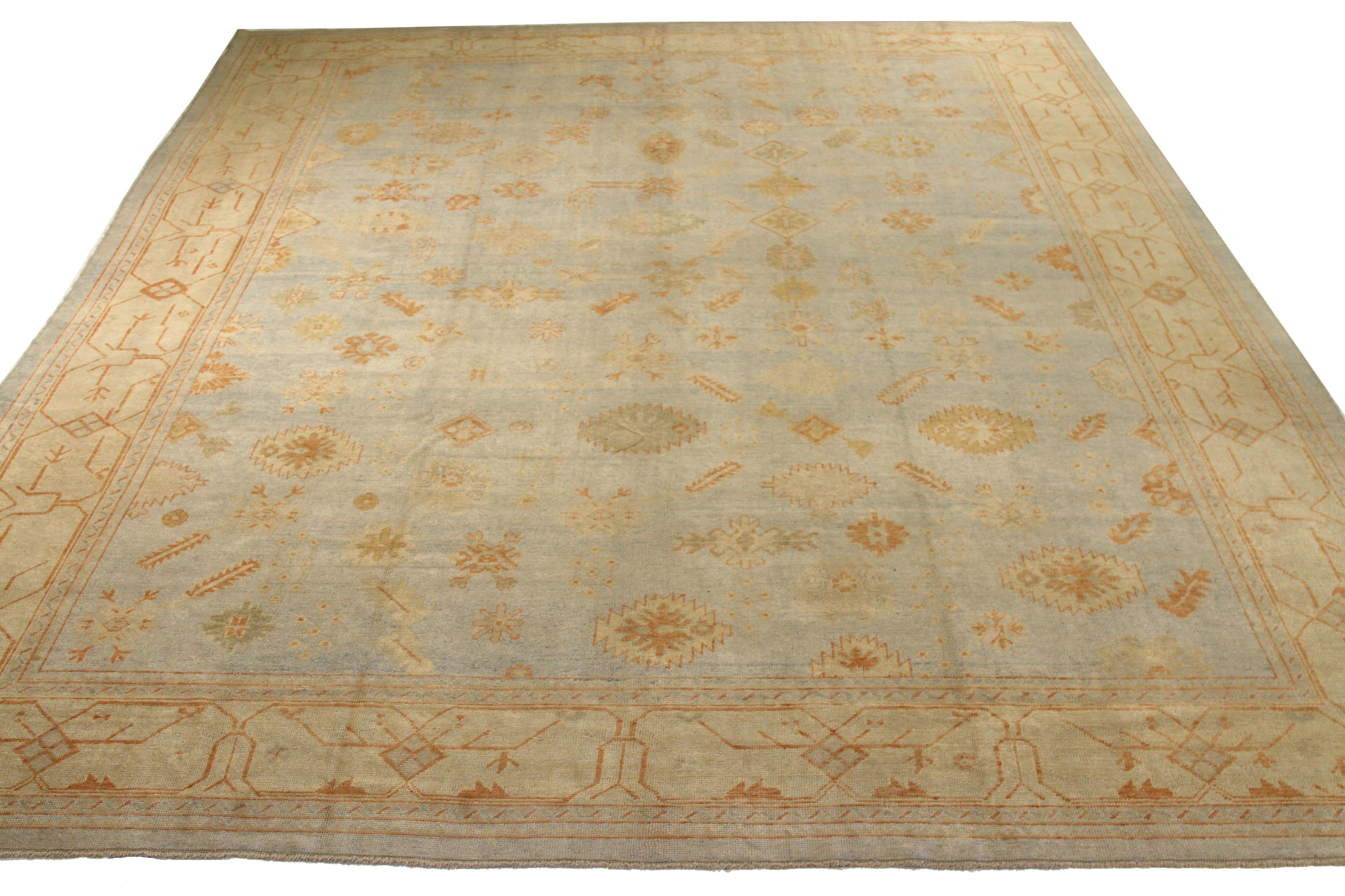 Modern 21st century hand-woven Turkish area rug made from fine wool and all-natural vegetable dyes that are safe for people and pets. This beautiful piece features a rich field of floral details in various colors which is the traditional weaving