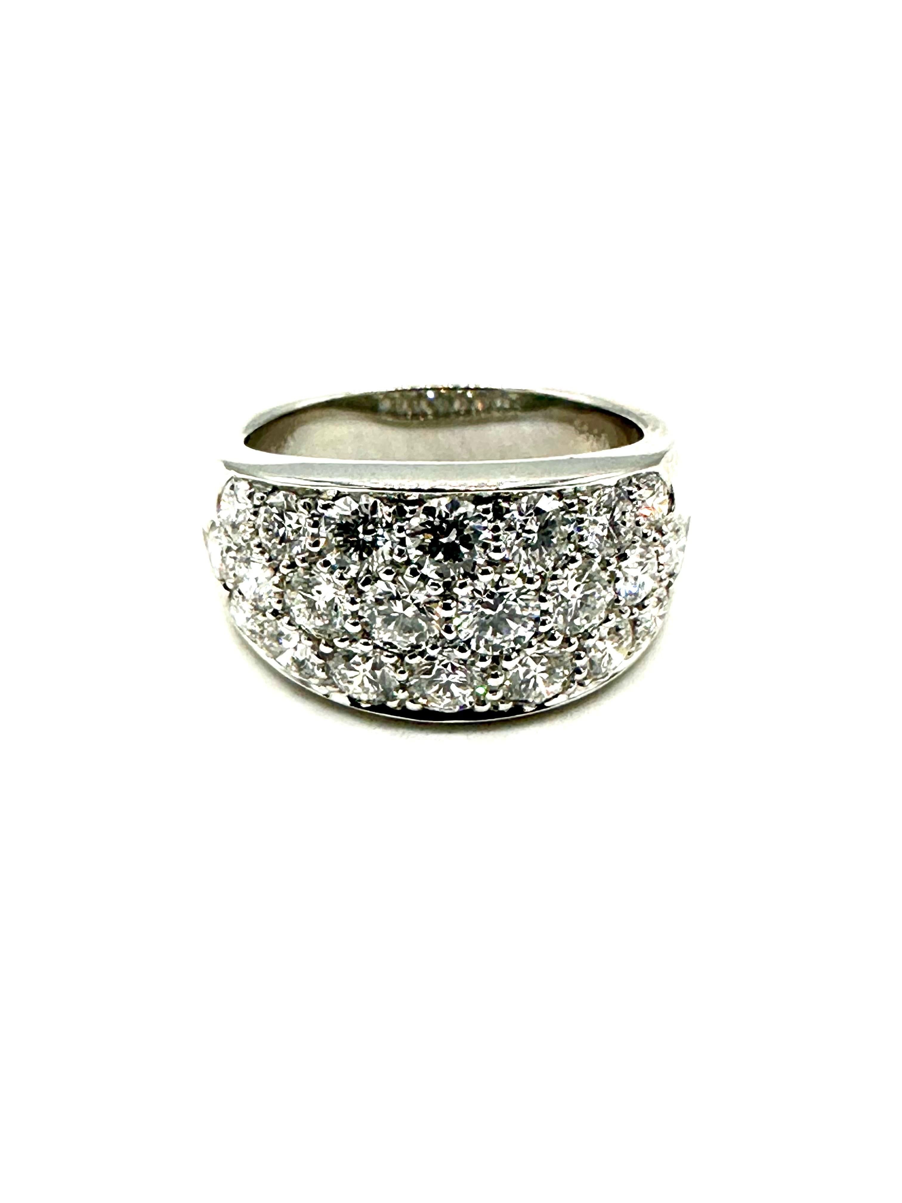 A gorgeous ring with blinding fire!  This ring is designed with 22 ideal cut, round brilliant Diamonds, set three rows across, in platinum.  The Diamonds are F color, VS clarity.  The Diamonds stretch almost to halfway around the ring, and the top