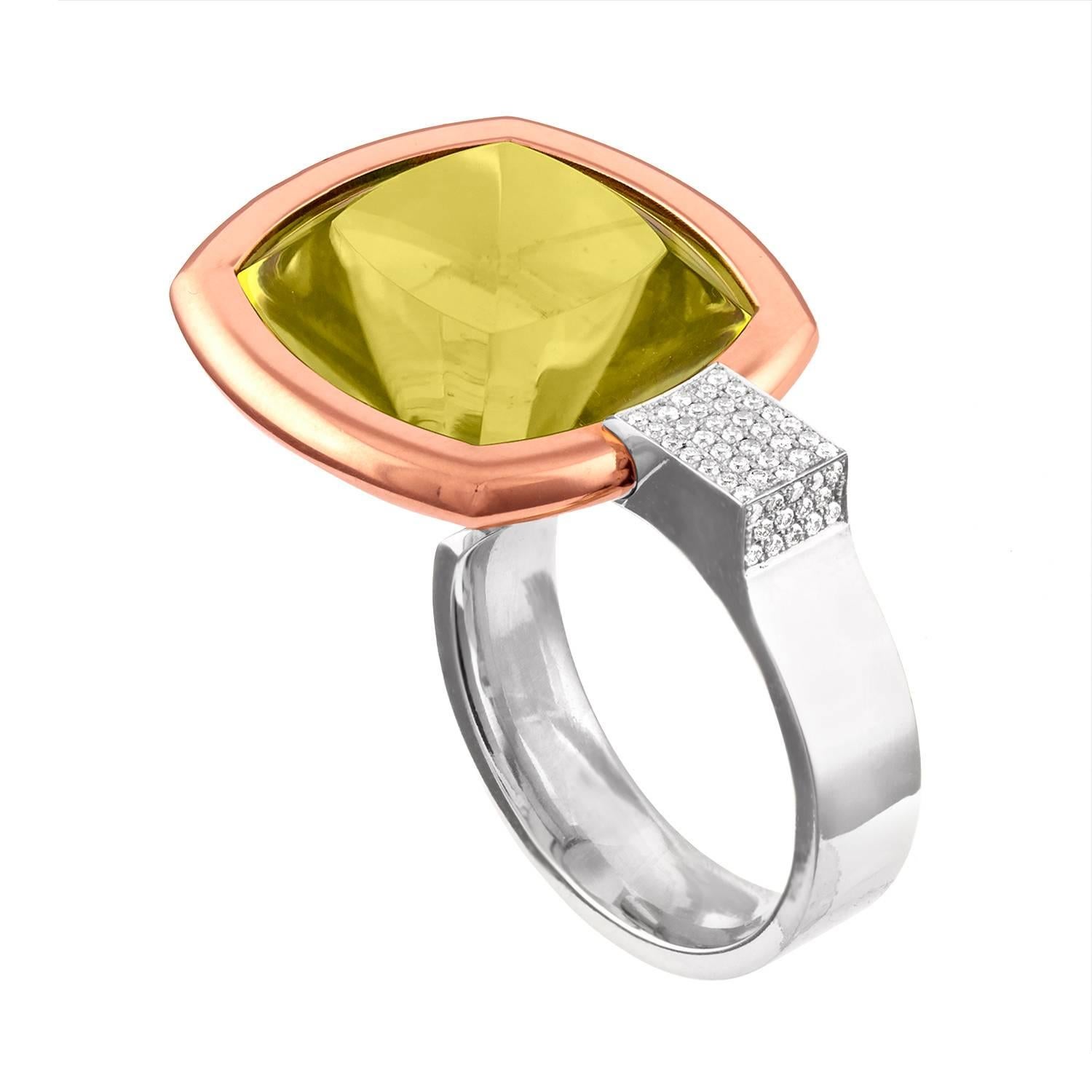 Modern Large Ring
The ring is 14K Rose And White Gold
The center stone is a 25.00 Carat Lemon Citrine
There are 0.75 Carats F VS
The ring is made to be worn on the middle finger.
The Citrine nestles between the middle finger and the ring finger.
The