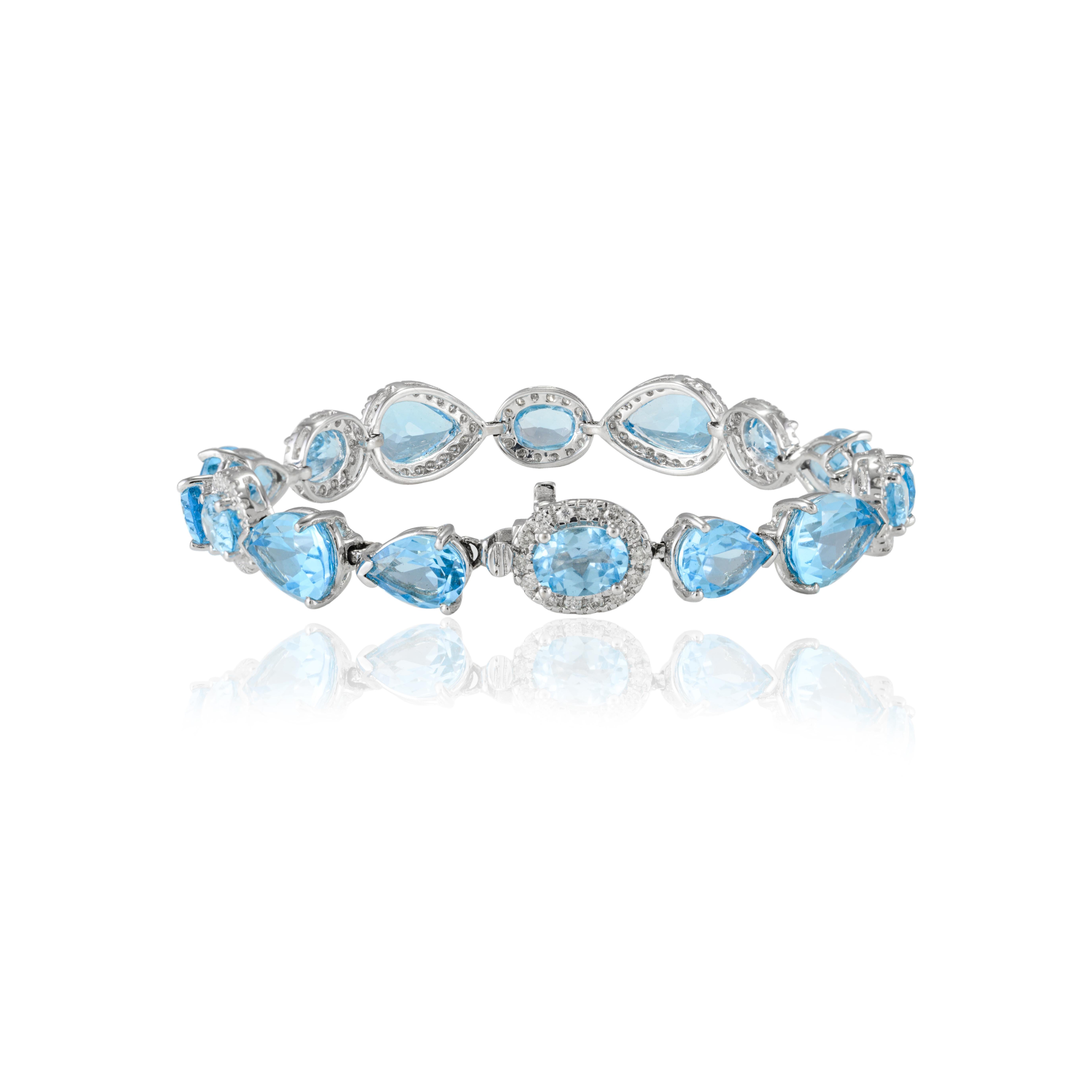 25.92ct Mixed Cut Blue Topaz and Halo Diamond Tennis Bracelet 18k White Gold For Sale 1