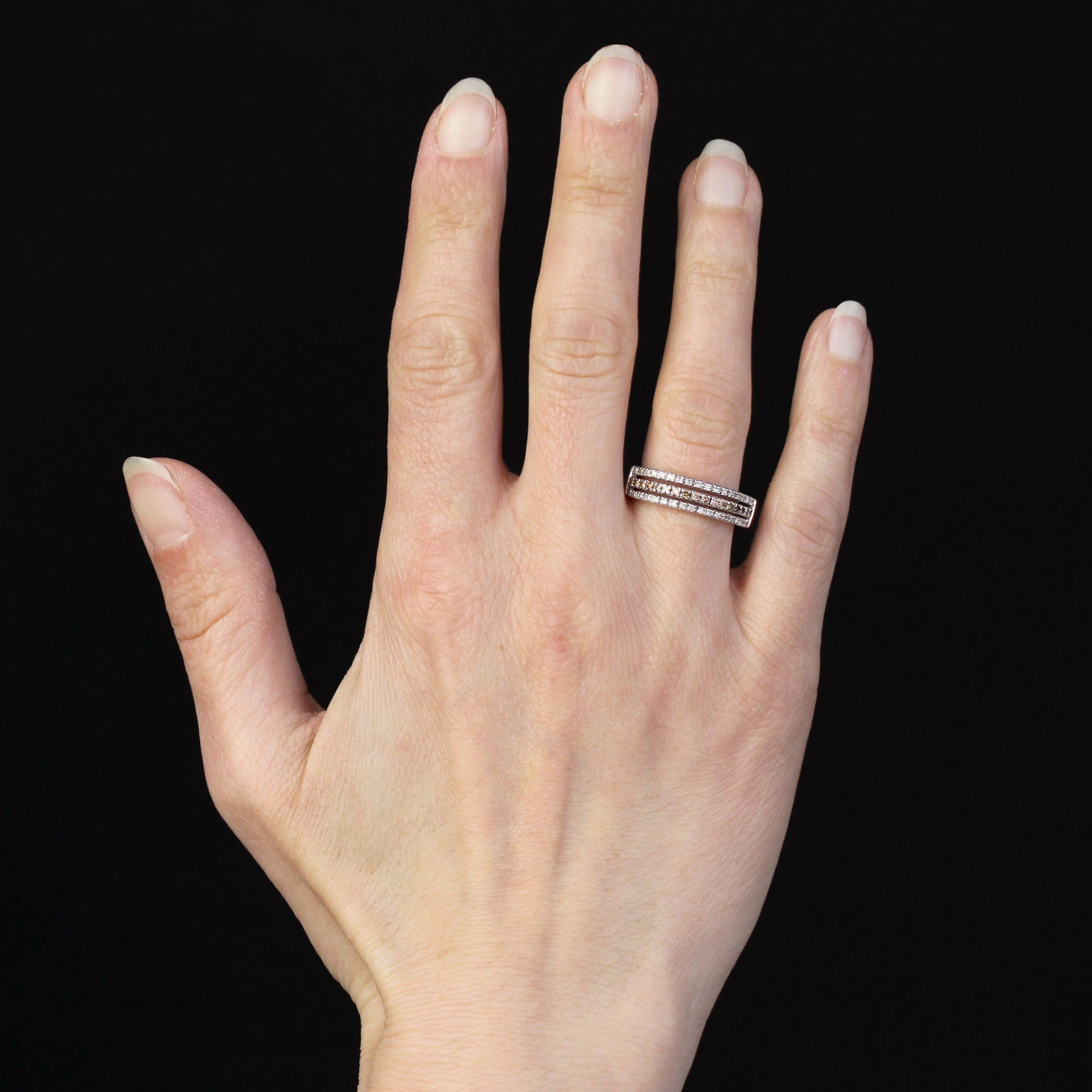 Ring in 18 karat white gold.
This second-hand ring features 3 lines of diamonds at the top, with the middle line set with cognac diamonds. The inside of the ring is engraved “Alain”.
Height : 5.3 mm approximately, thickness : 3.7 mm approximately,