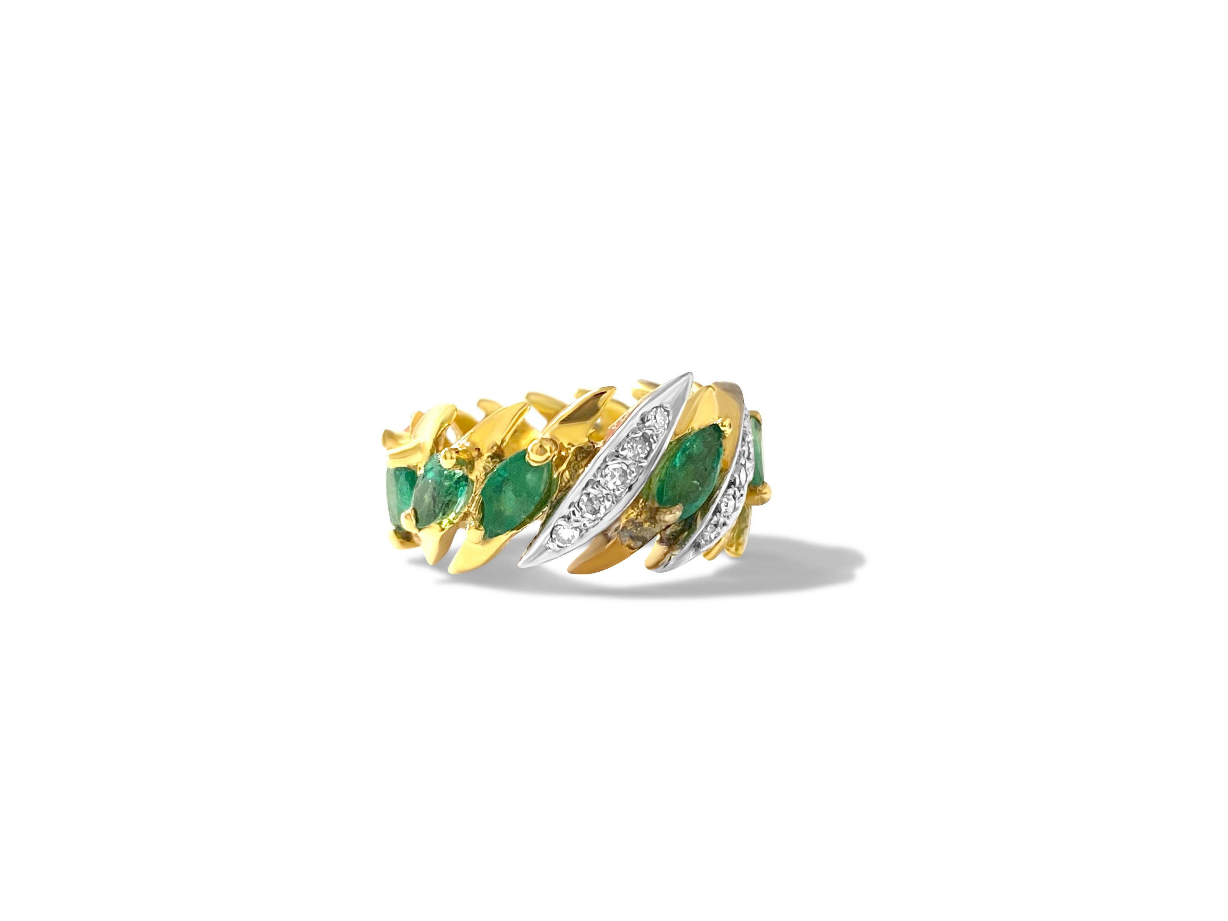 Material: This ring is made of 14K yellow gold. 
The emerald has a marquise shape and weighs 2.75 carats, with 11 natural earth-mined emeralds. 
The gem is of top quality. 
The diamonds, approximately 0.30 carats in total, are round brilliant cut,