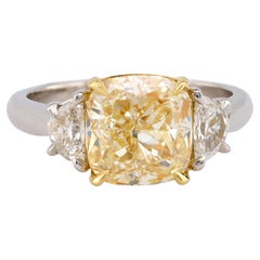Modern 3.08 Carat EGL Fancy Yellow Diamond Platinum Three Stone Ring