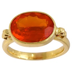 Modern 3.90 carat fire opal 18k yellow gold east-west bezel ring