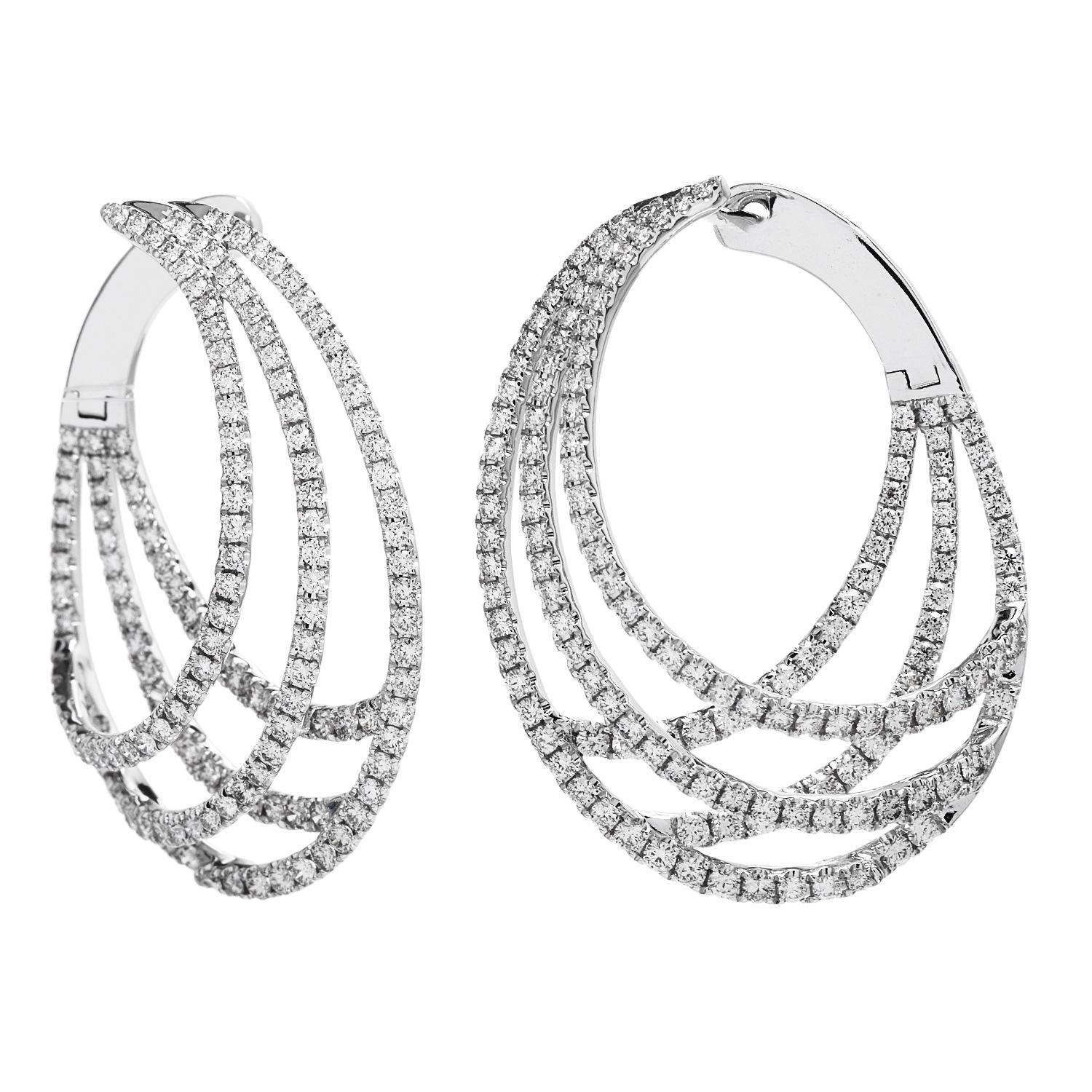 An evening event can be spiced up with the diamond dance of these exquisite hoops. 

 Finely crafted in durable 14K white gold.

These sparkly pieces are decorated from top to bottom with a dance in genuine Diamonds. These hoop earrings are a