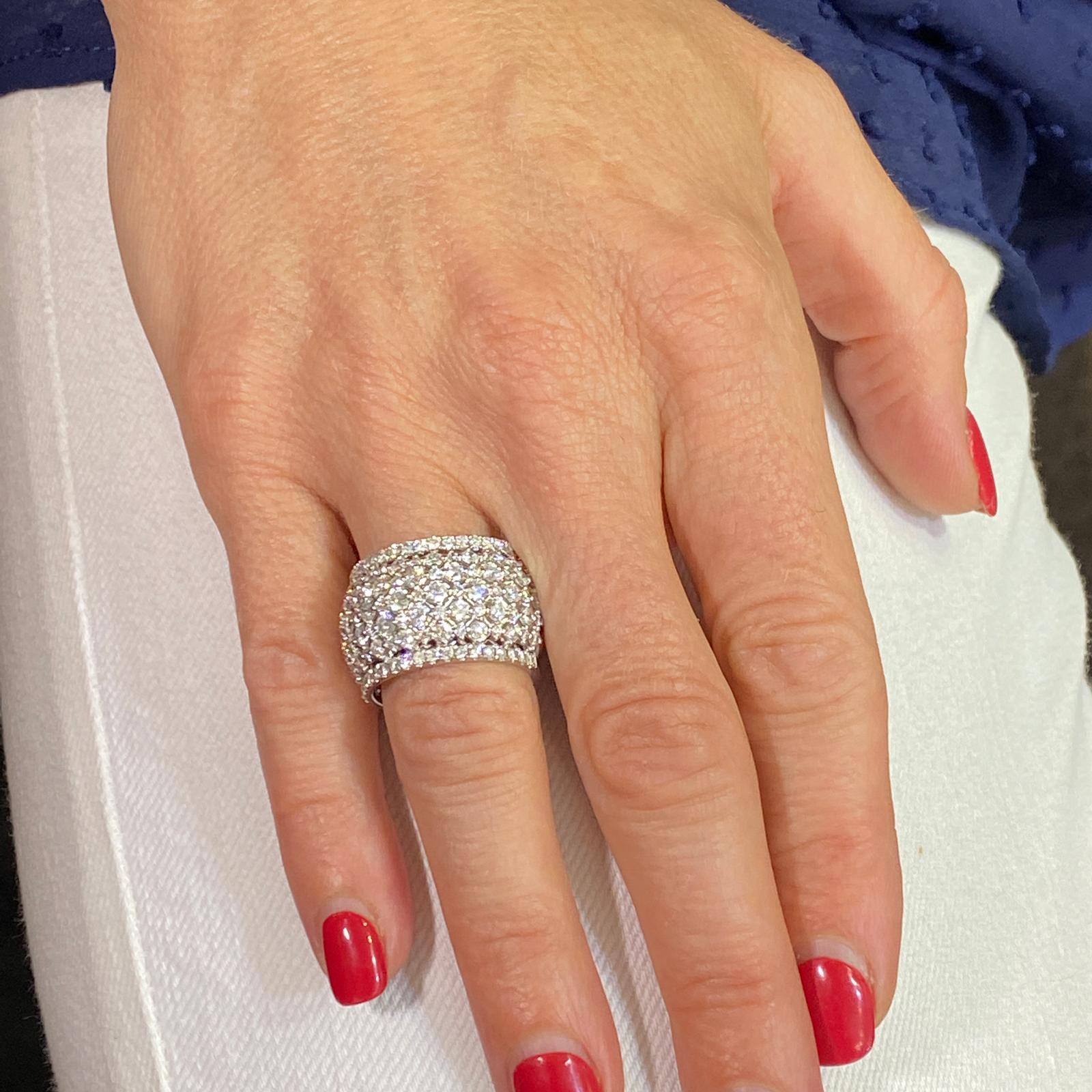 Beautiful diamond lattice band fashioned in 18 karat white gold. The wide band features round brilliant cut diamonds weighing 4.00 carat total weight and graded G-H color and VS2-SI1 clarity. The wide band measures 14.5mm in width and is currently