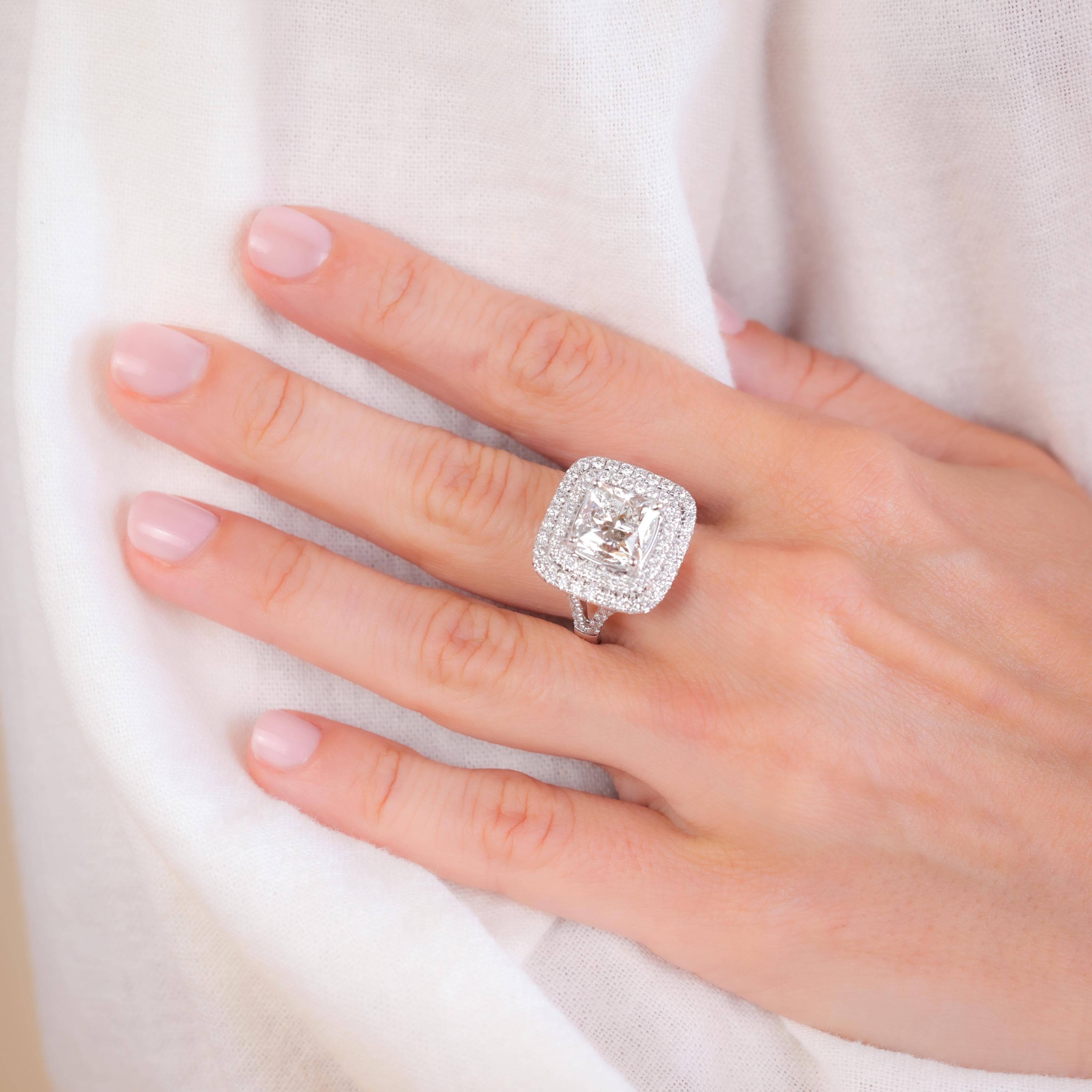 Certificate: AGS 
Certificate #:0008227601
Stone: Diamond
Cut: Dream Cushion Cut
Weight: 5.015 Carats
Color: G
Clarity: VS2
Accent Stone: 80 Diamonds
Cut: Round
Weight: 1.28 Carats
Color: E-F
Clarity: VS1
Metal: 18K White Gold
Era: Modern
Circa: