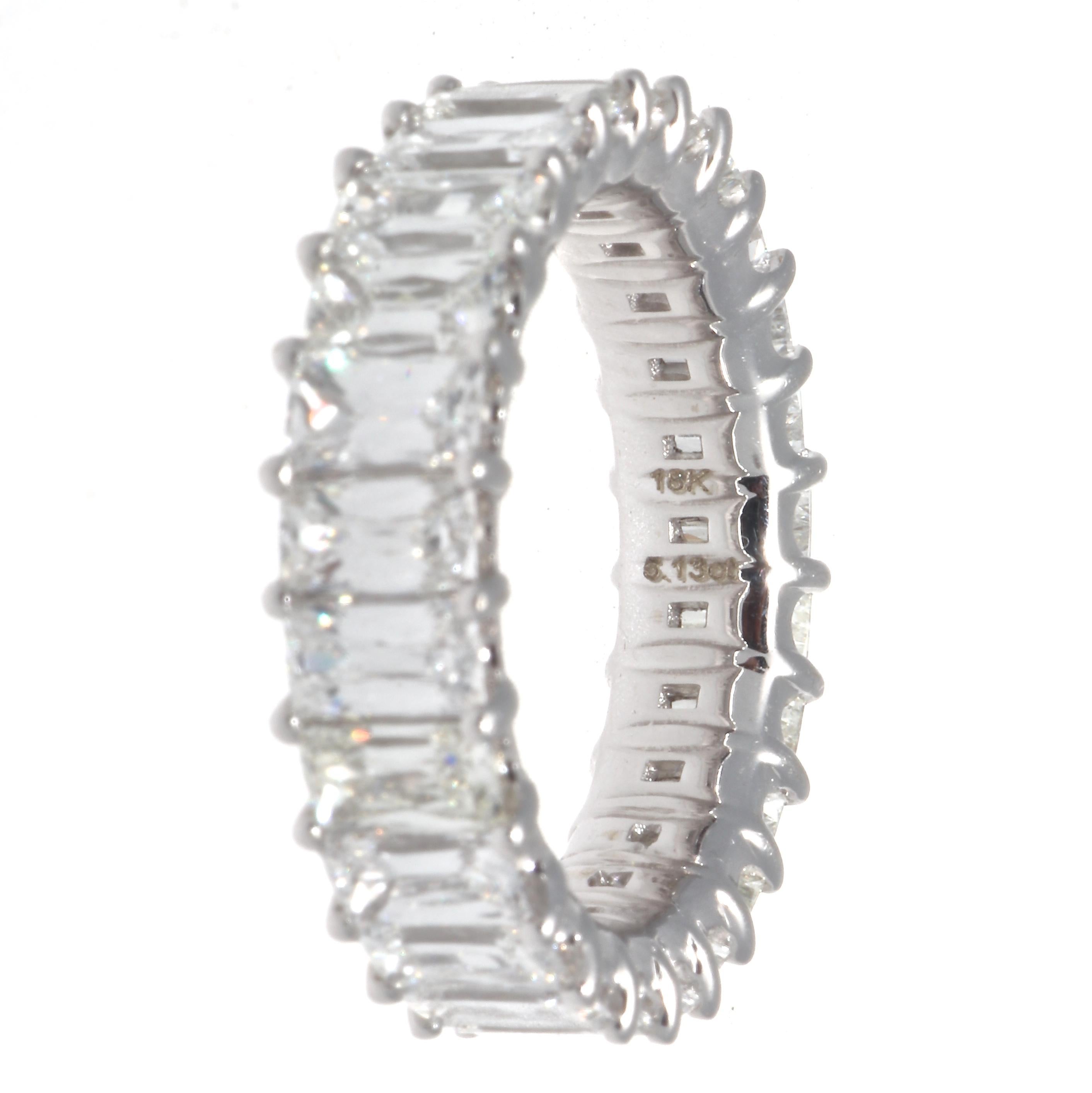 Modern triple cut diamond 18k white gold eternity ring band. Featuring 18 diamonds that weigh approximately 5.13 carats, graded G-H color, VS clarity. Circa 2019. Size 6 and cannot be resized. 
Our 1stdibs Recognized Dealer/Platinum Seller