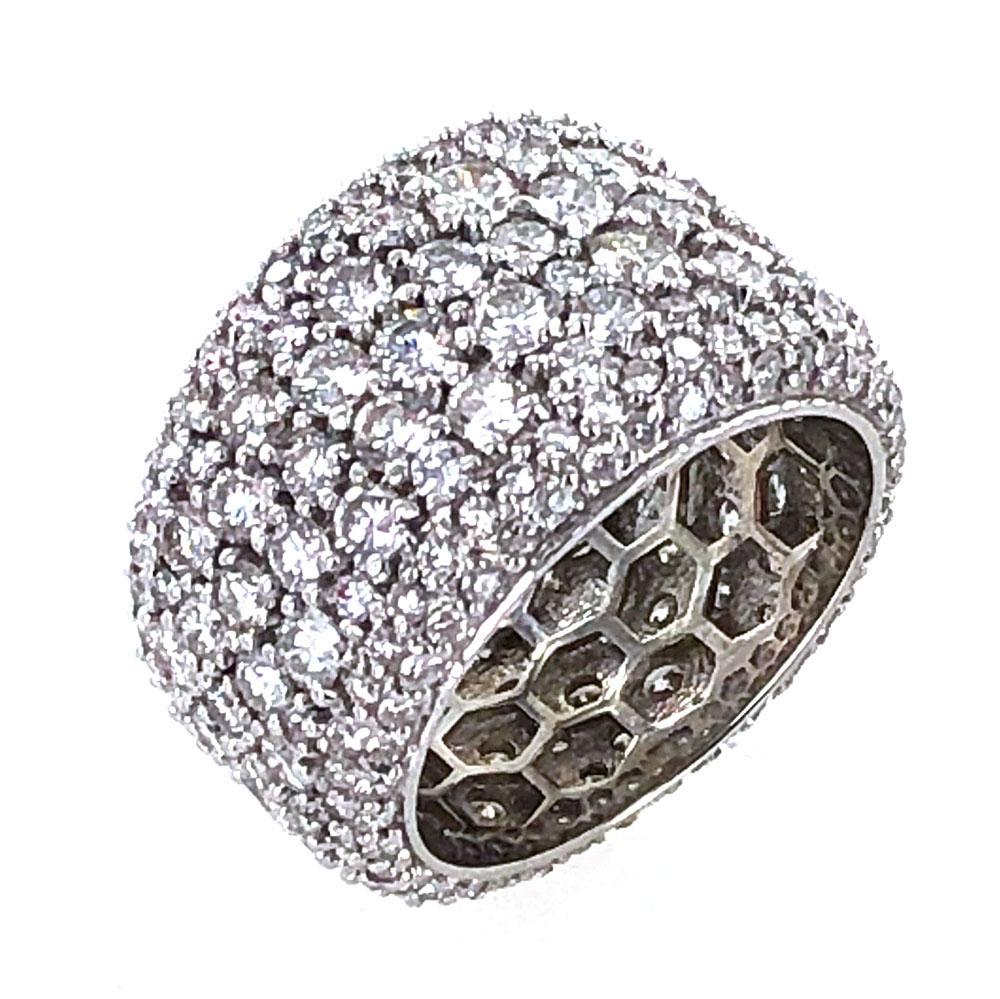 Pave diamond band featuring 6.00 carat total weight of round brilliant cut diamonds. The diamonds are graded F-G color and SI clarity. The band is currently size 7, and tapers from 15-10mm in width. 