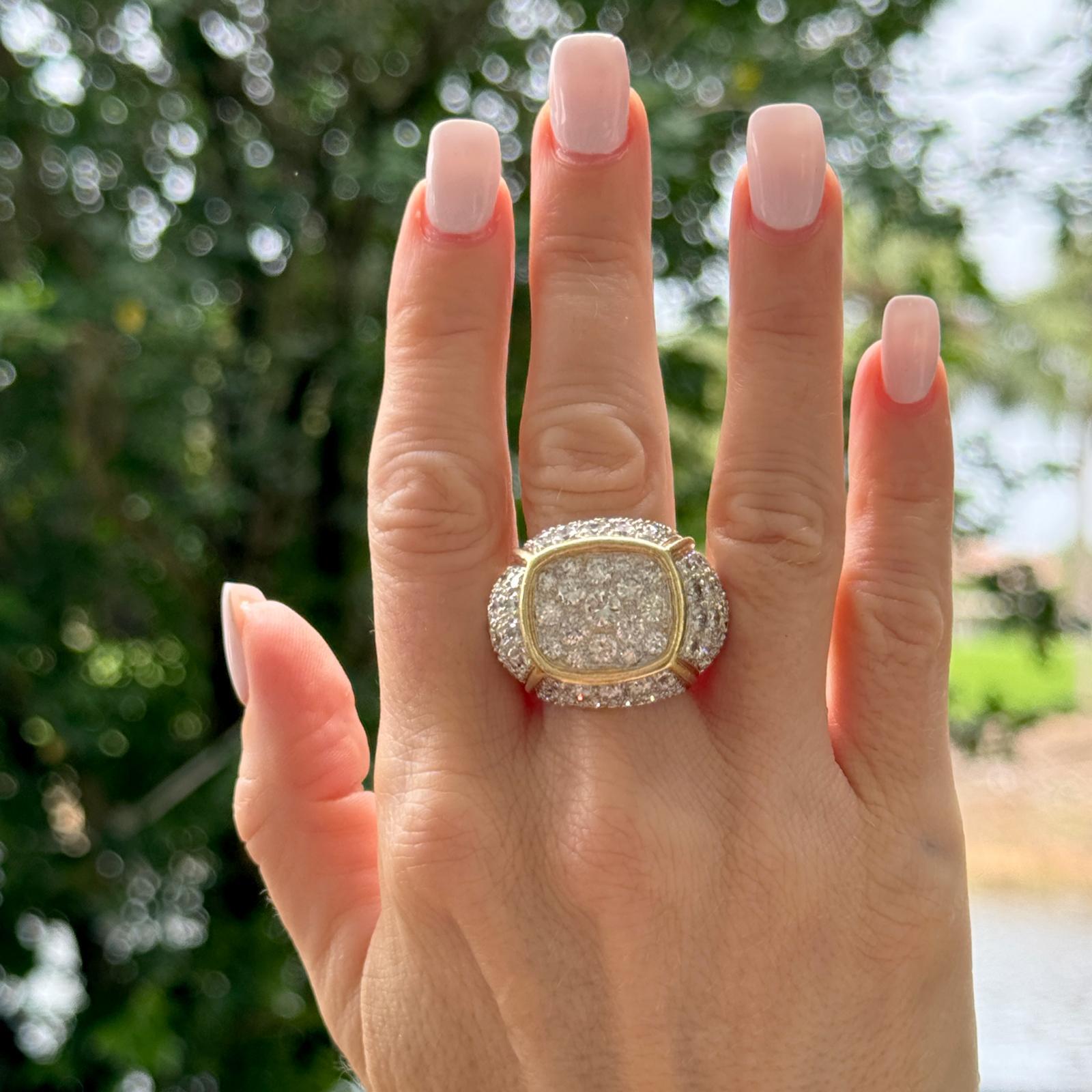 This bold handcrafted Pavé Diamond Statement Ring is a striking piece, meticulously crafted in a combination of 18 Karat White and Yellow Gold. The ring features a substantial top that measures 22 x 28 mm, adorned with an exquisite array of