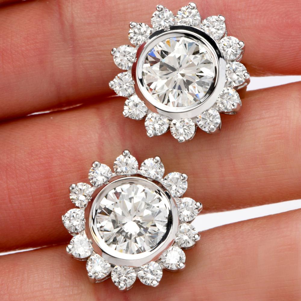 Only for the faint of heart!!  Classic but not Ordinary!!  These magnificent Halo Earrings were cast in 18.4 grams of Luxurious Platinum.

Adorning the center of these incredible earrings are large, round faceted, brilliant Cut Diamonds weighing
