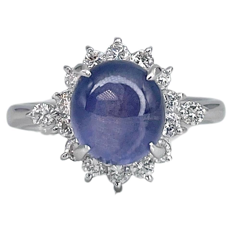 Modern 900 Platinum 2.30 Carat Violet Sapphire 0.35 Carat Diamond Cluster Ring For Sale
