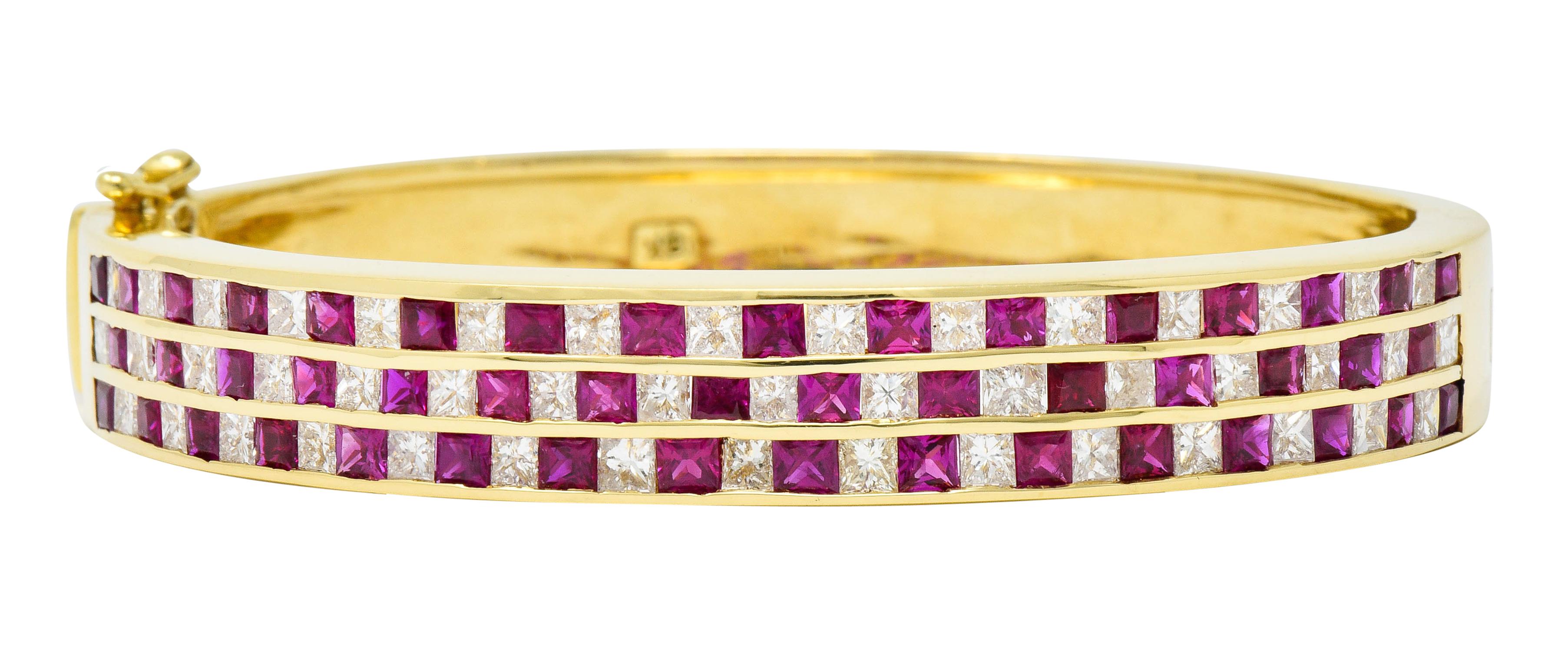 Hinged bangle bracelet channel set to front with three rows of rubies and diamonds

Princess cut diamonds weigh in total approximately 3.6 carats with G/H color and SI clarity

Square cut rubies are vibrantly red to purplish-red in color and weigh