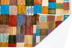 Tapis de laine abstrait moderne de style baloutche - damier en patchwork aux couleurs vives