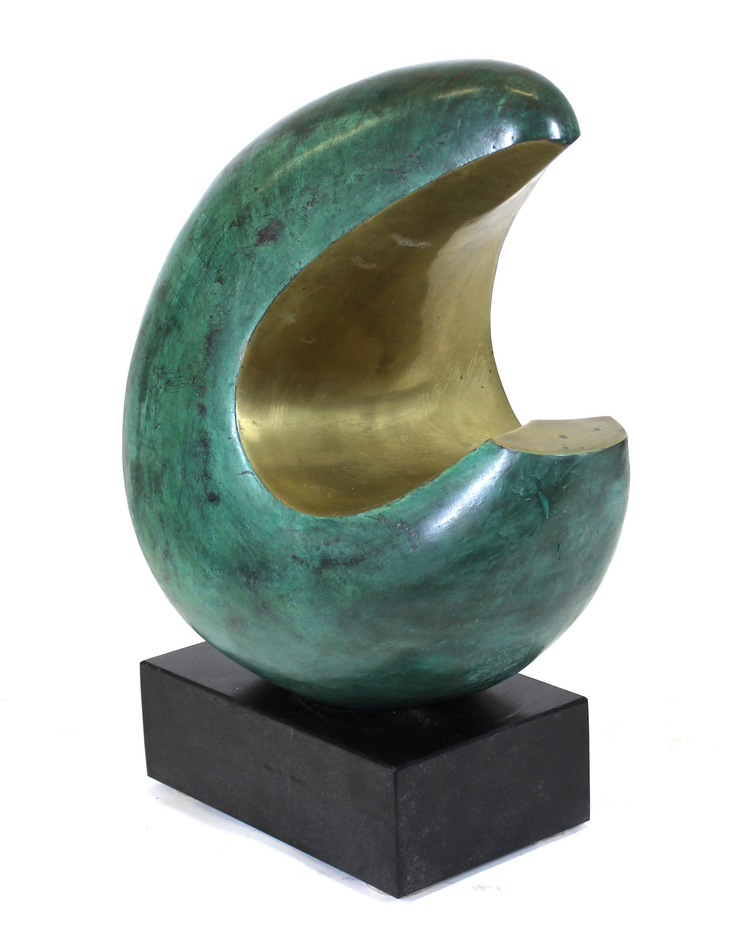 Modern abstract bronze sculpture with partial green patina, mounted on a black marble base.