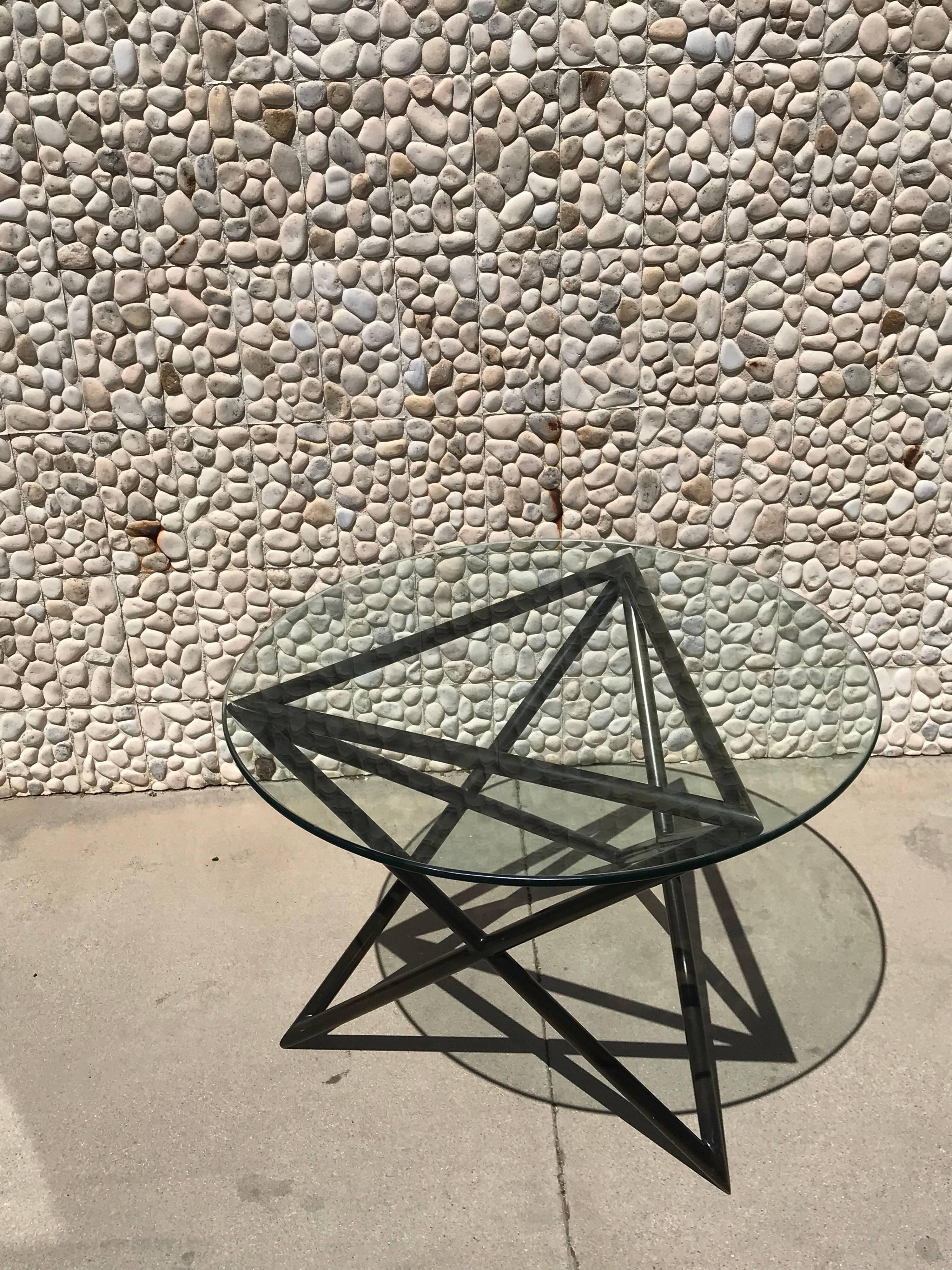 This gorgeous bronze table came from the same Steve Chase Estate as the gorgeous sofa on separate listing. Do not know if it is real bronze or high end bronze finish. Original glass top. Looks like an abstract work of art.

Known for their