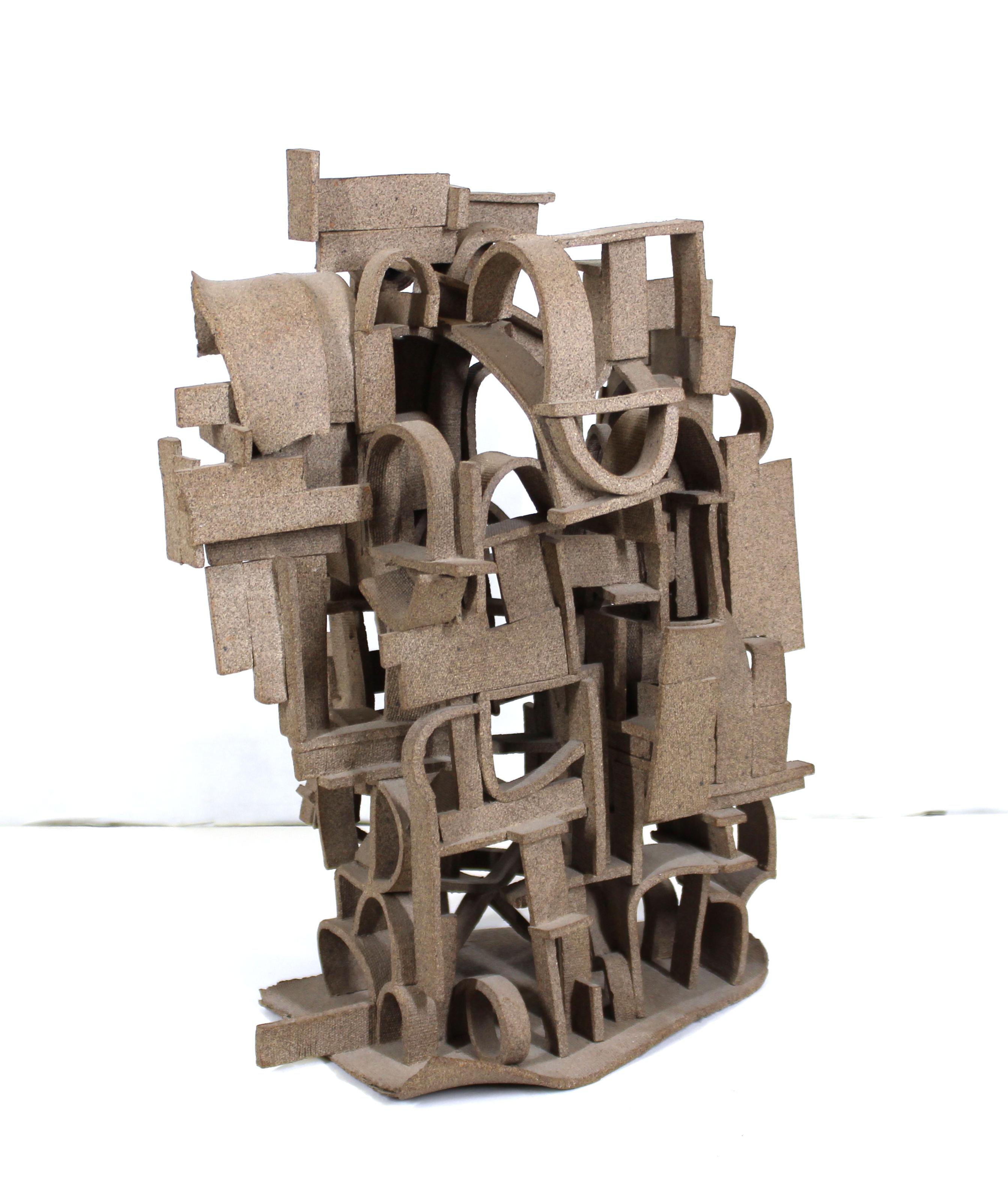 Modern Brutalist abstract tabletop sculpture made with composite material. The piece has an architectural constructed presence and no signature or mark. In great vintage condition with age-appropriate wear and use and a few minor areas where