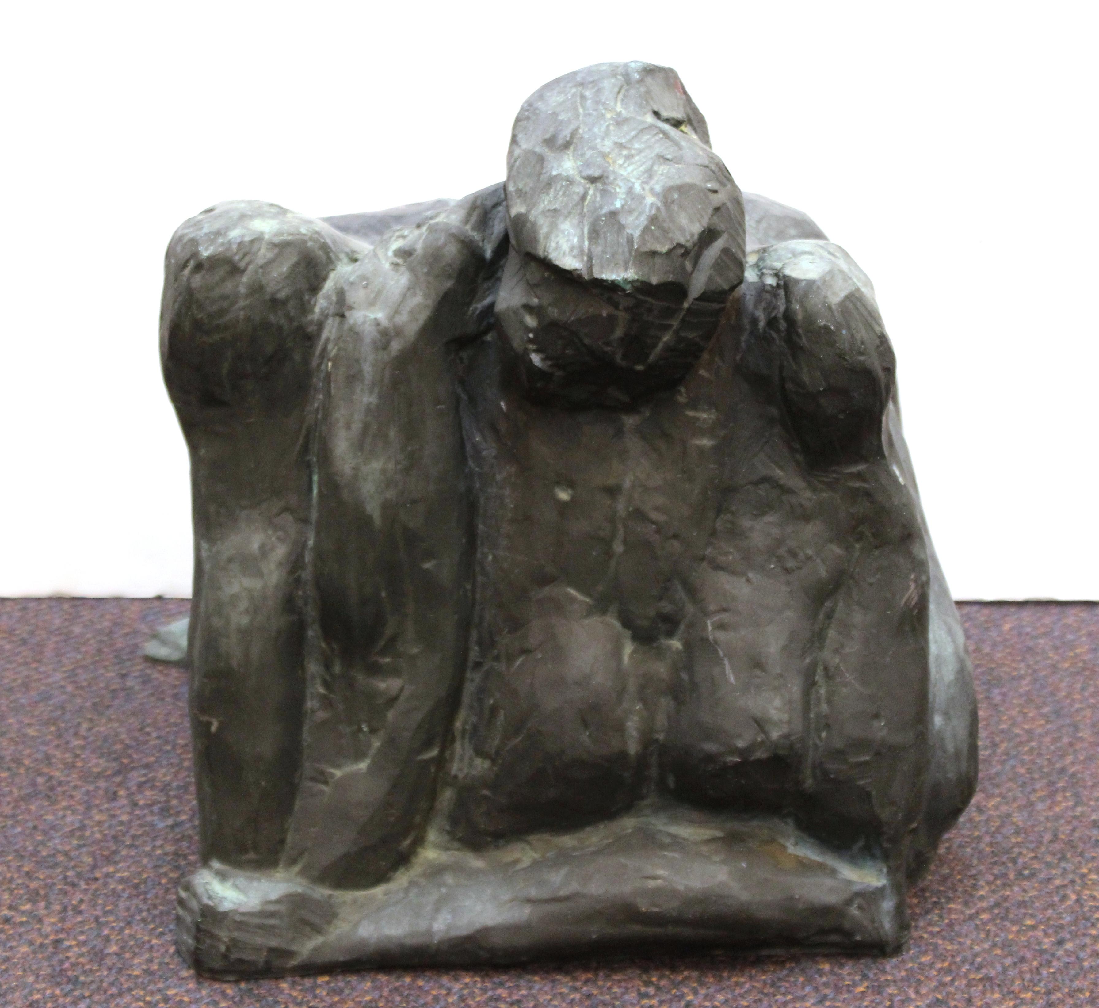Modern abstract sculpture cast in bronze, depicting a woman crouching on the ground. The piece was made in the mid- to late 20th century and is in great vintage condition, with age-appropriate patina.