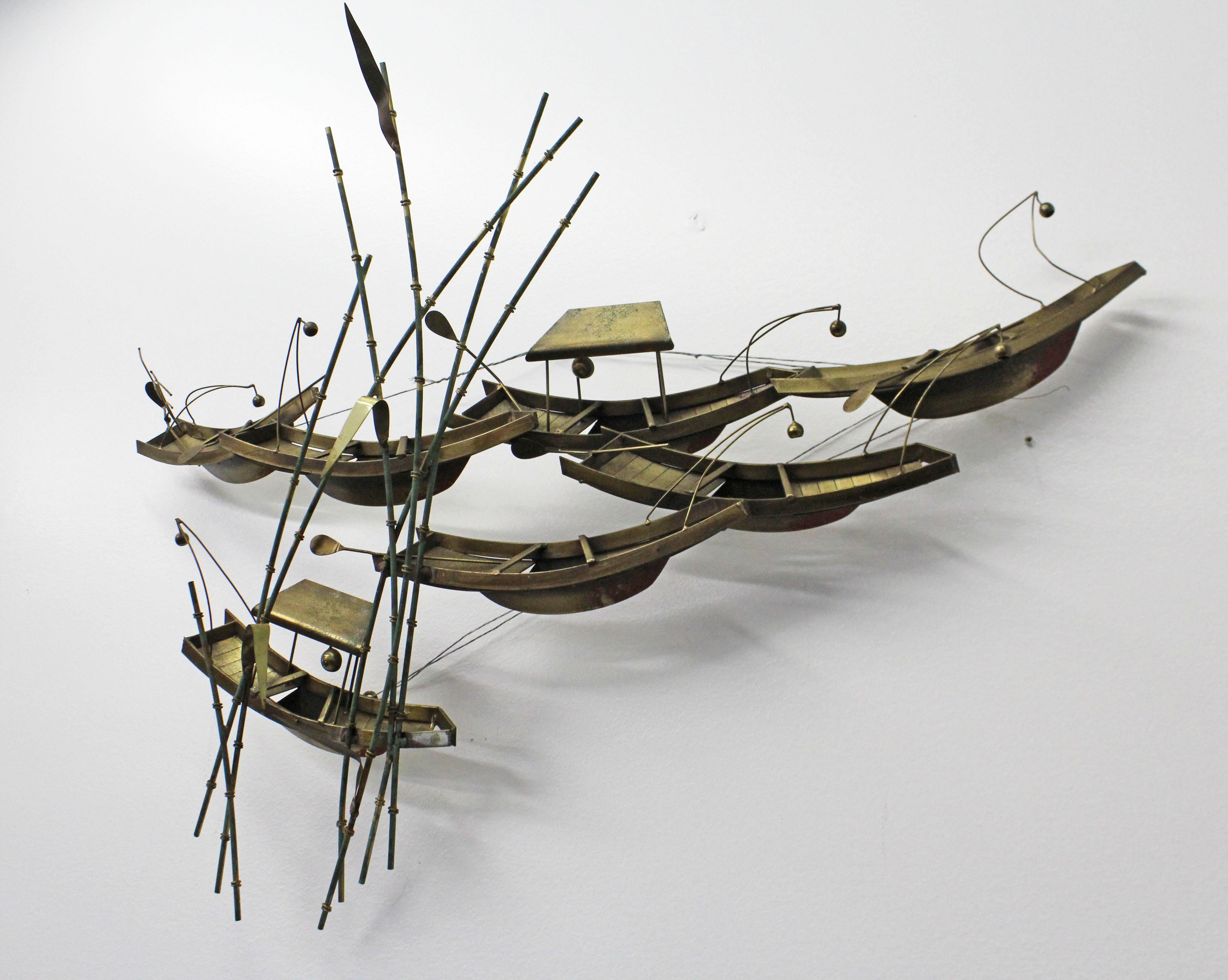 Offered is a vintage original signed Curtis Jerè sculpture entitled 'Boats and Bamboo'. The piece is made of brass, featuring an Asian Style boat and bamboo design. Has metal wire on the back for hanging. It is in good vintage condition with some
