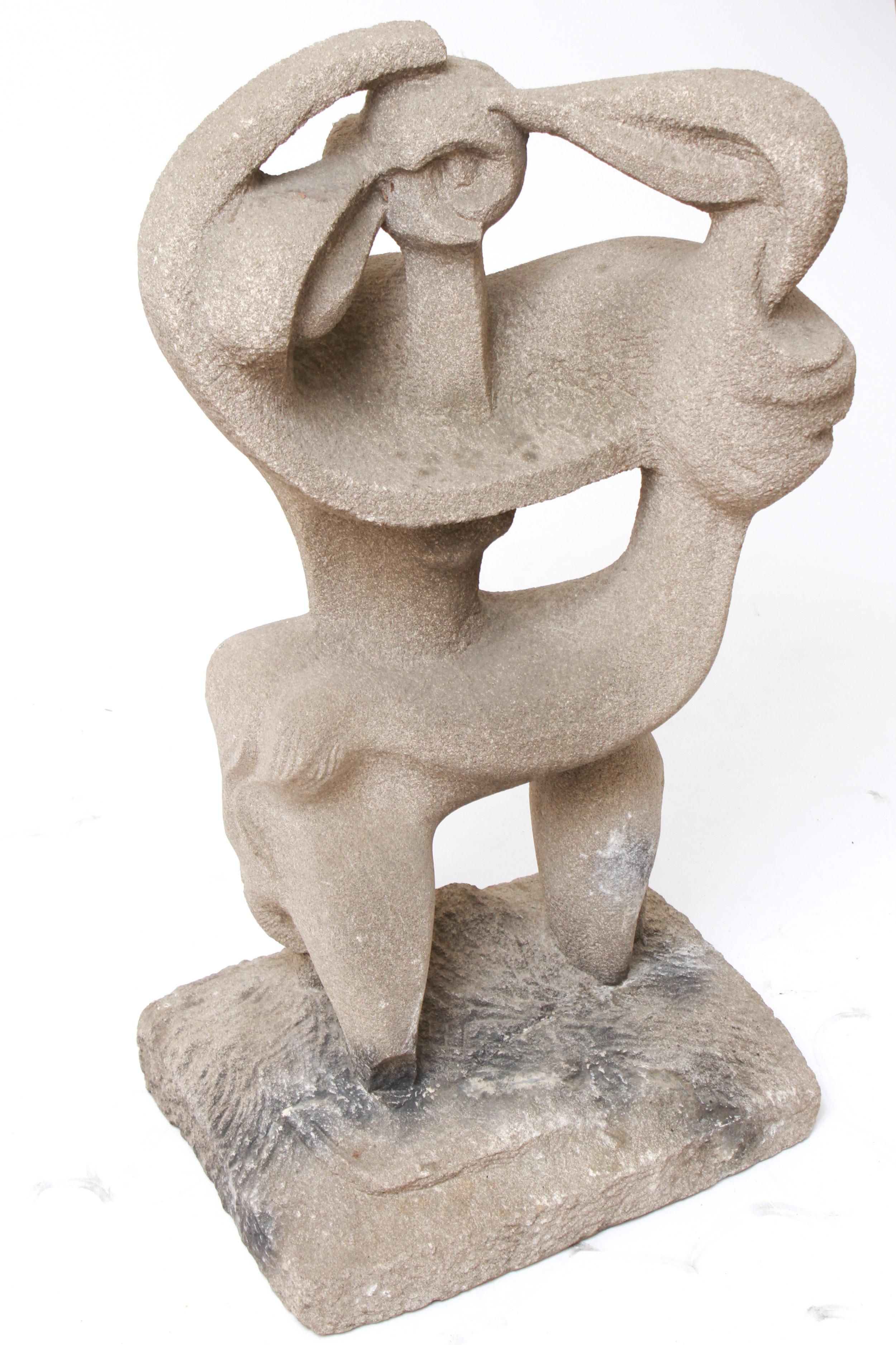 Modern abstract sculpture made of concrete, depicting a stylized figure. The piece has a square base but is unsigned. In great vintage condition with age--appropriate wear and use. Can be used as outdoor statue.