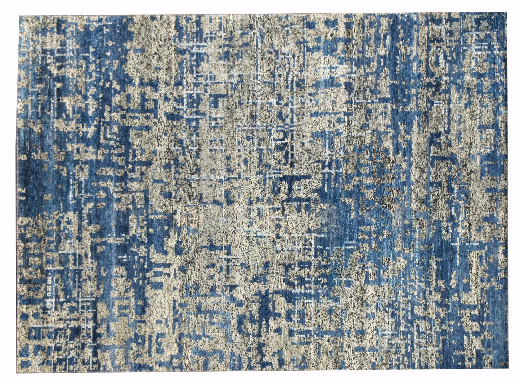 Hand-knotted silk pile on a cotton foundation.

Abstract modern deign

Origin: India

Field color: Blue, gray, black, ivory.
