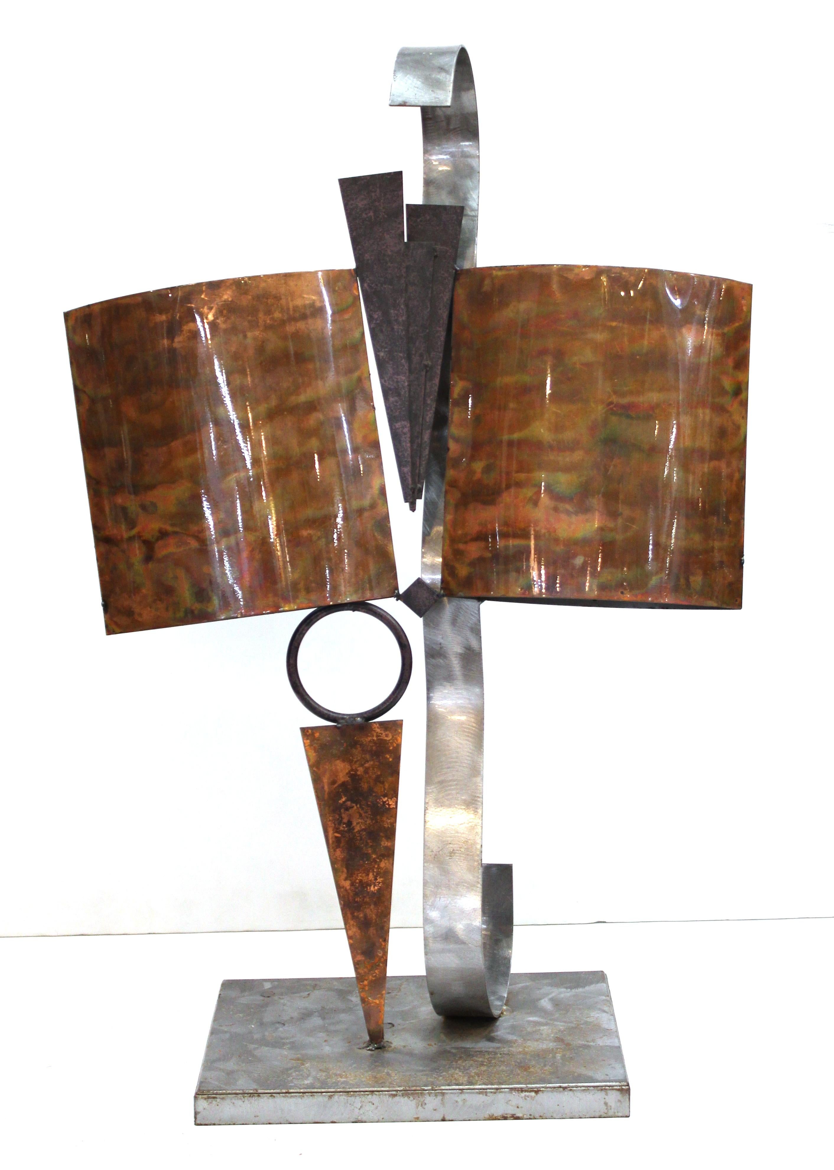 Modern abstract welded metal tabletop sculpture. Made of various shapes and metal elements, some with glaze. The piece is in great vintage condition with age-appropriate wear and use.