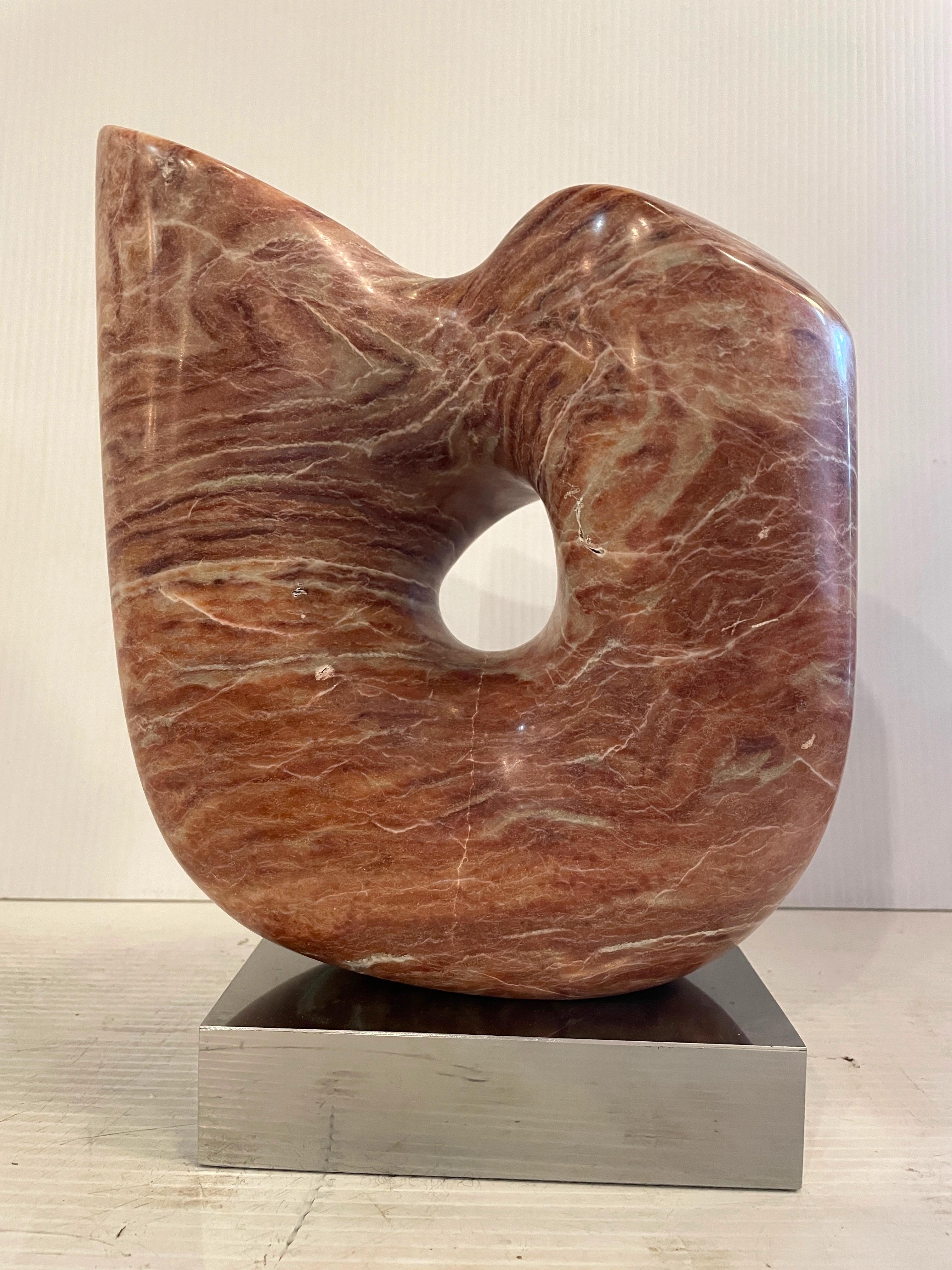 Unique polished pink marble abstract sculpture with a chrome base. This beautiful one of a kind sculpture would make a great art piece to add some warmth and sophistication to your home or office.

Please confirm item location NY or NJ with dealer.