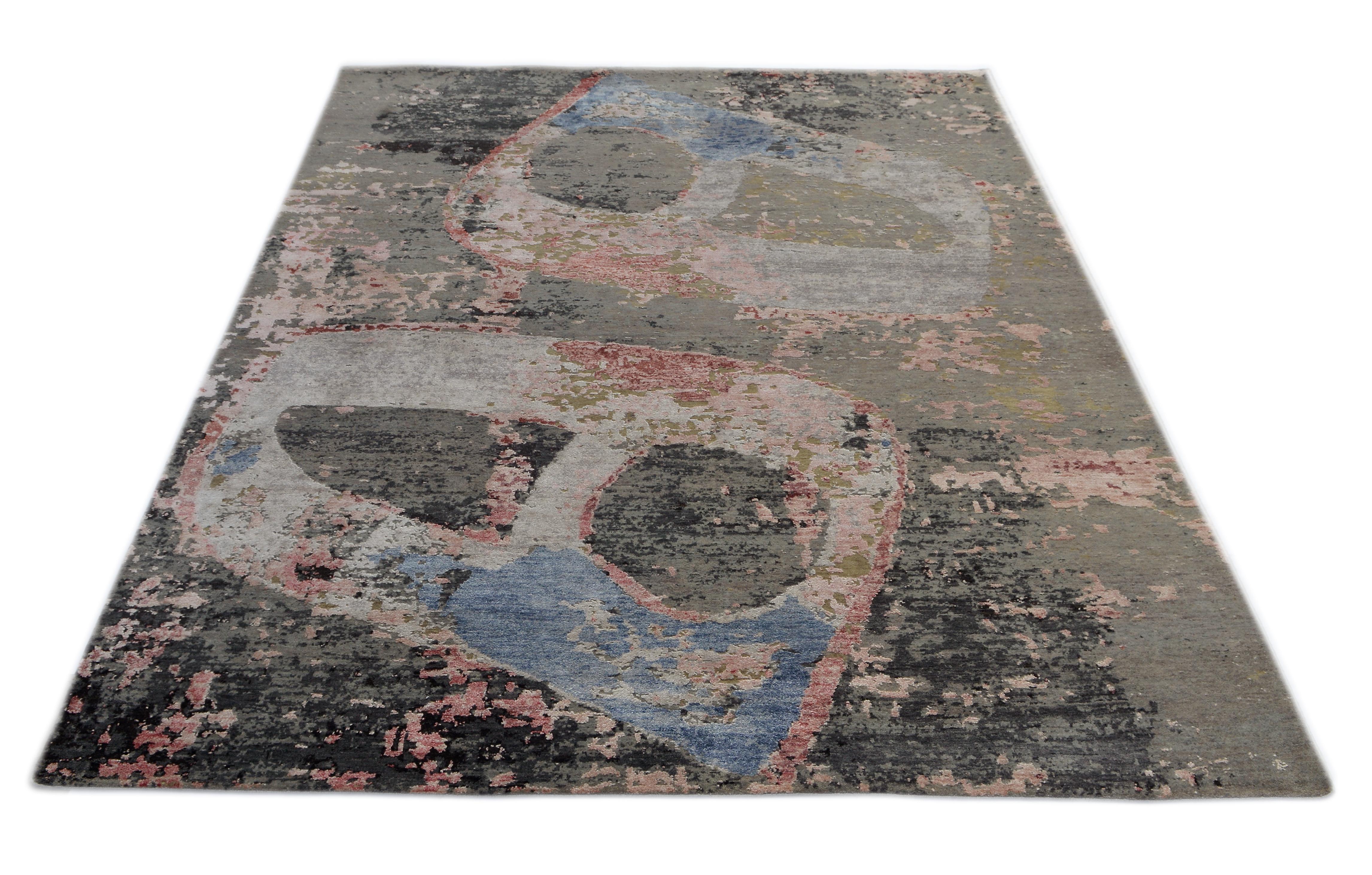 A new addition to the handmade rugs in the abstract rug line by Rug & Kilim, this 5'8” x 7'10' modern rug is hand knotted in a unique, proprietary blend of quality wool and silk, the natural luster of the latter bringing out modern hues of beige,