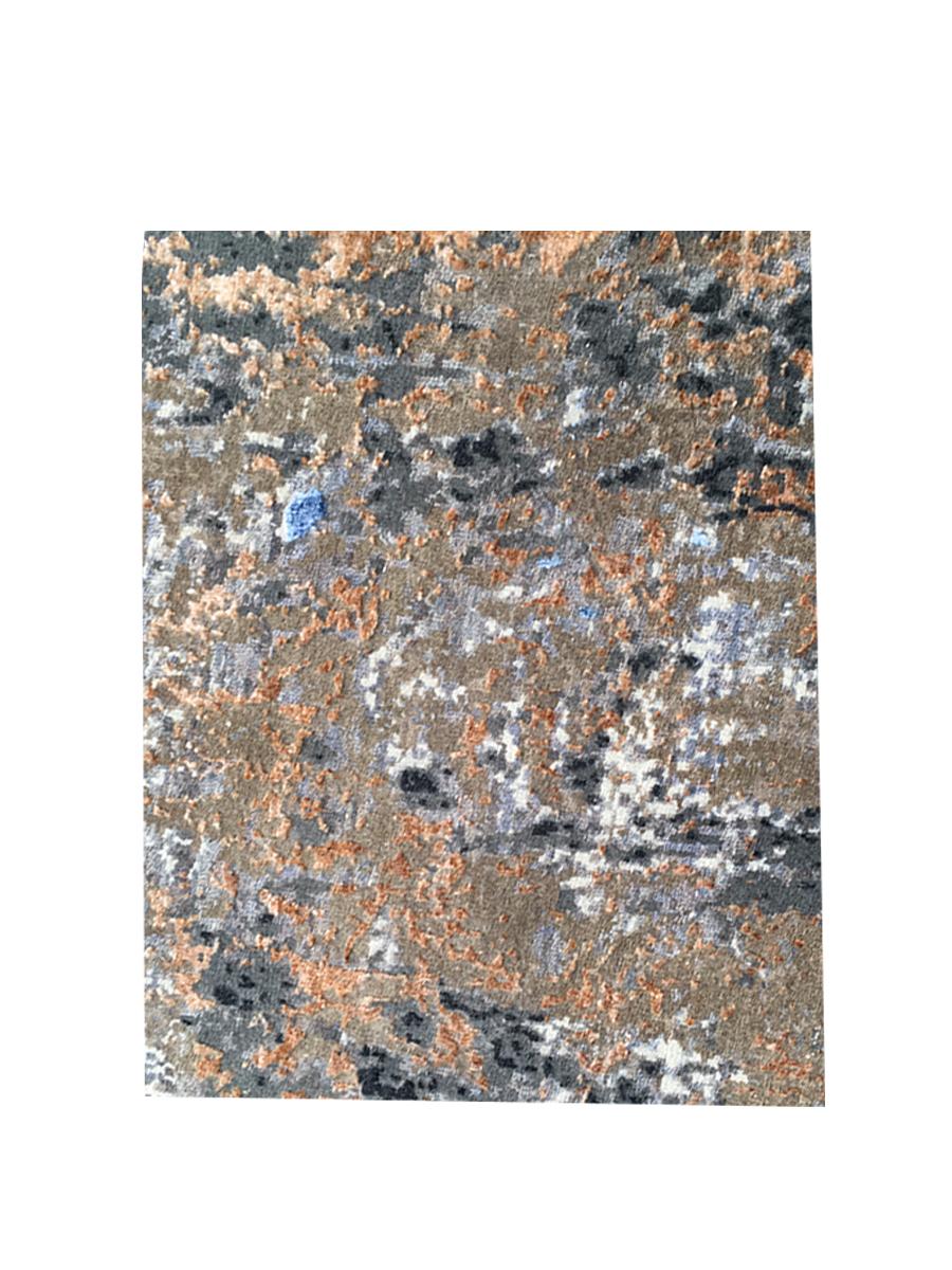 A new addition to the handmade rugs in the abstract rug line by Rug & Kilim, this 8'3” x 10'1” modern rug is hand knotted in a unique, proprietary blend of quality wool and silk, the natural luster of the latter bringing out transitional hues of