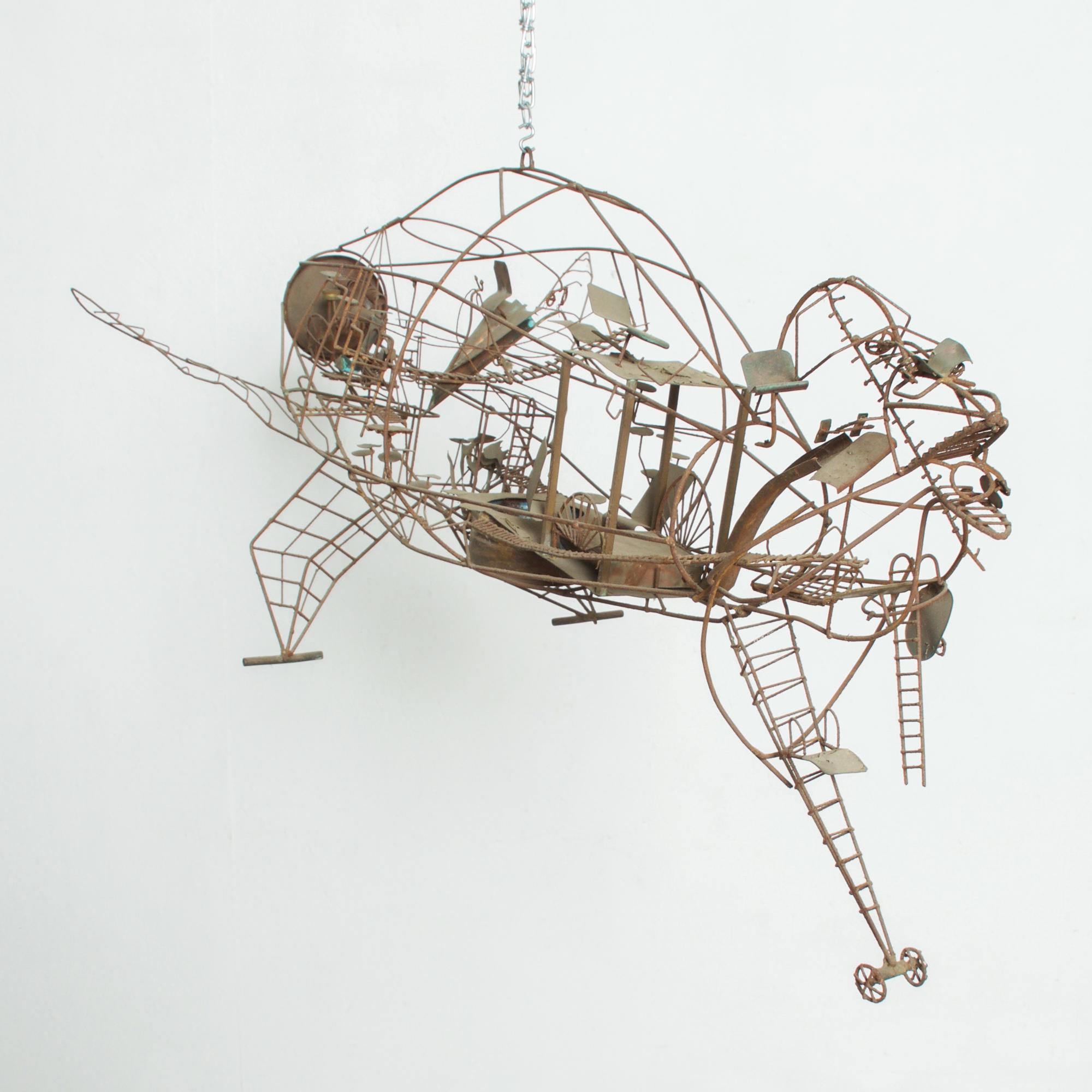 Aviation Sculpture in Wire
1960s Detailed Abstract Wire Art Kinetic Hanging Metal Sculpture in the manner and style of C Jere and
Raymor Studios.
Unmarked.
Measures: 48W x 18 H x 22 D
Unrestored preowned Vintage Item Condition. Rust is present. Some
