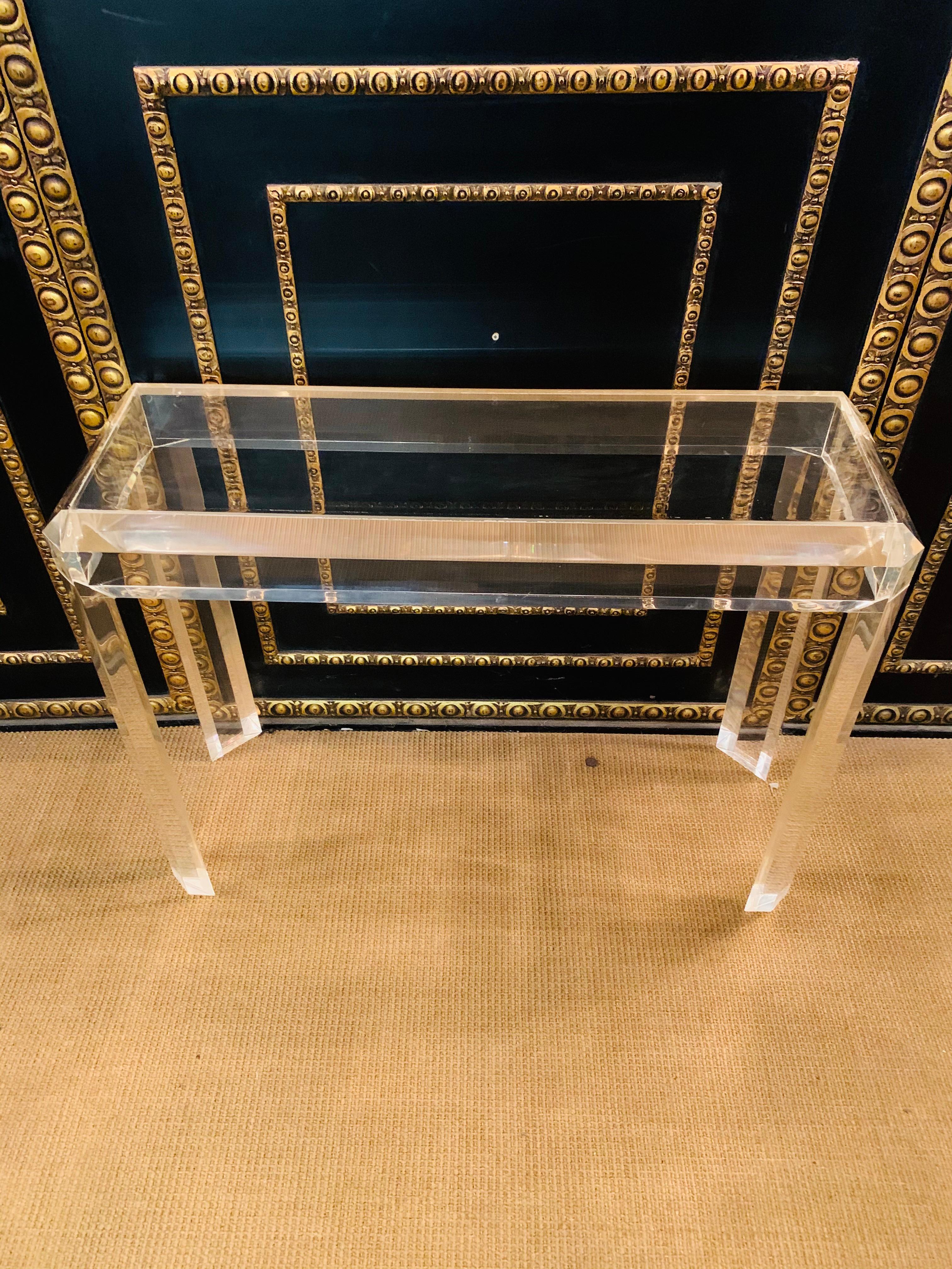 Modern acrylic console with 4 high legs New York style.