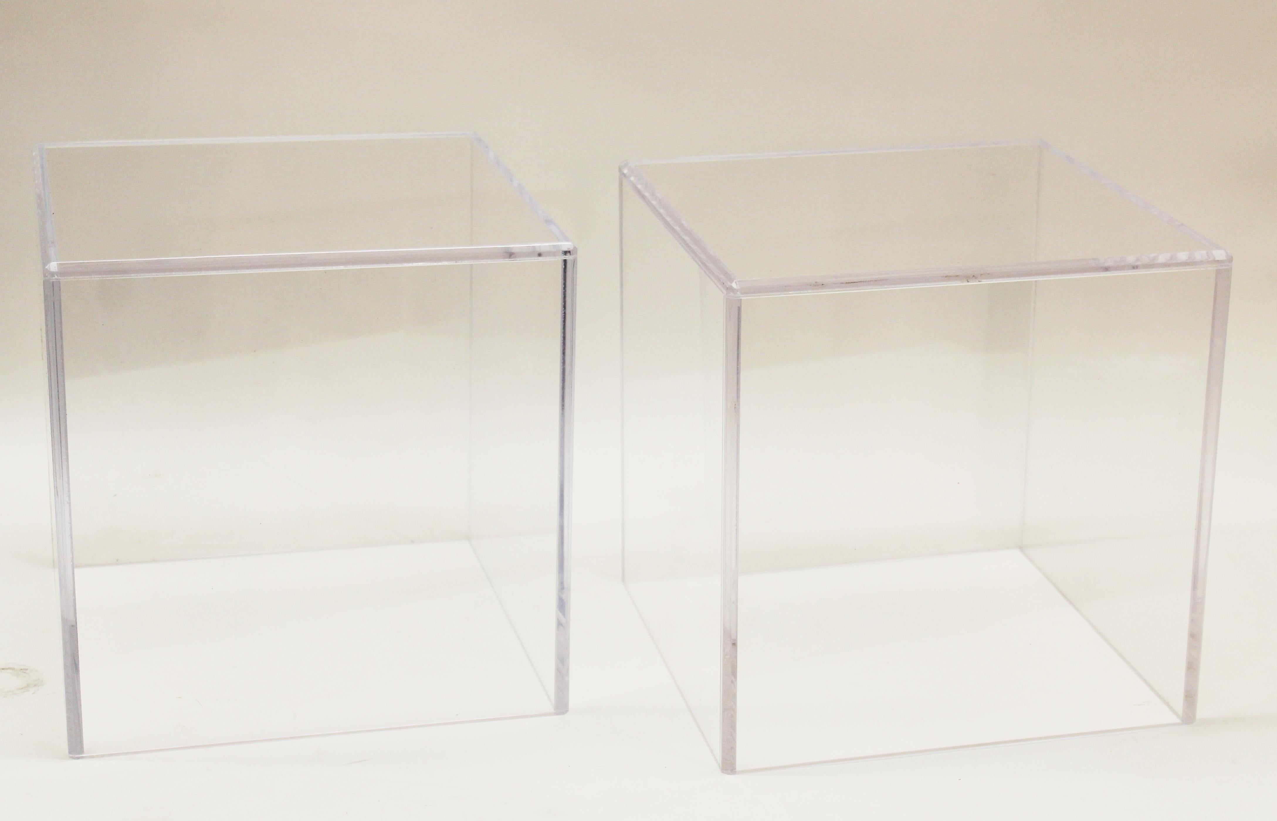 Modern pair of display pedestal cubes in clear acrylic. Can also be used as side tables. Minor surface wear.
(Two pairs available).