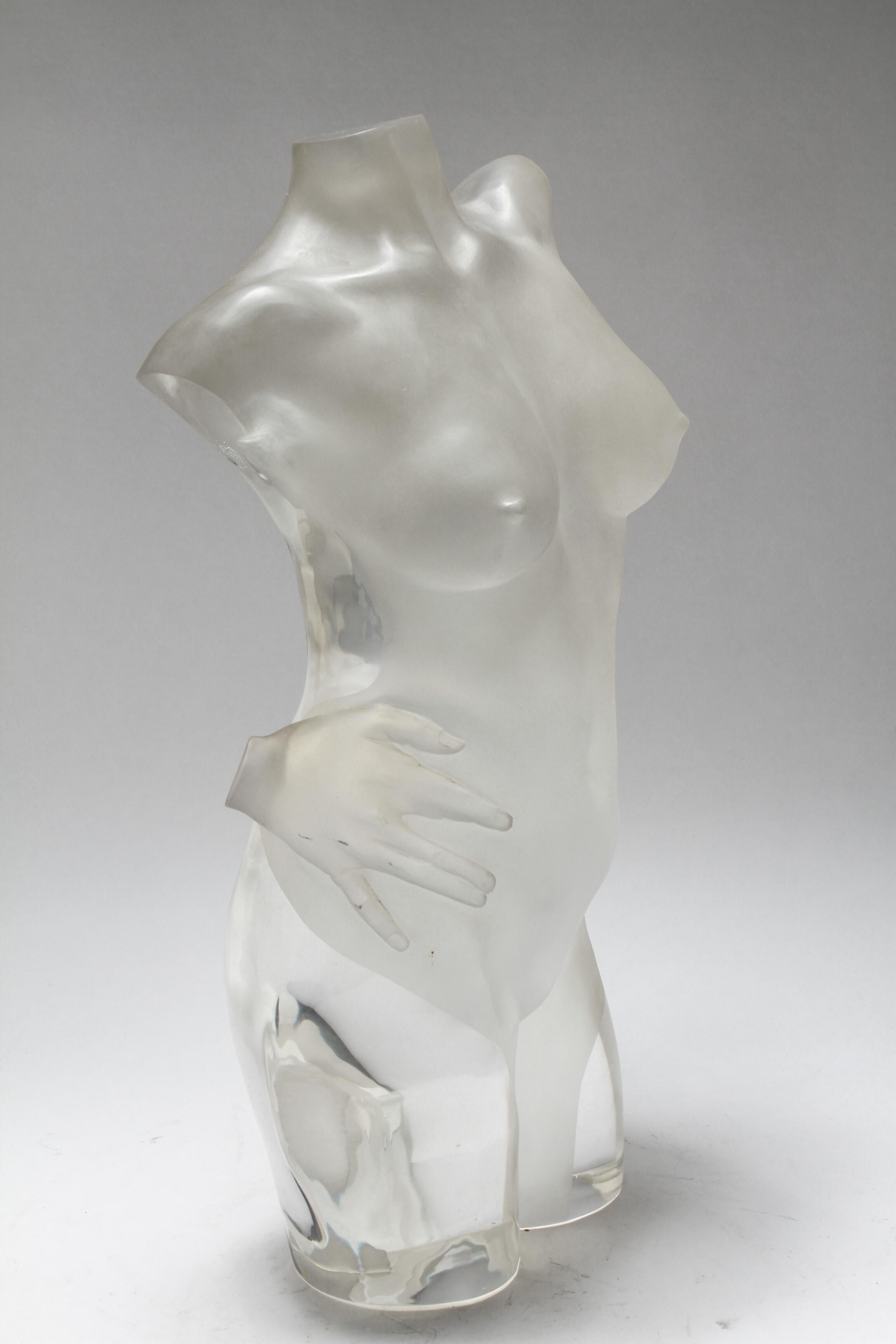 Modern acrylic sculpture of a woman's torso with a disembodied hand on her hip. The piece is made of colorless acrylic with frosted and clear motif. In great vintage condition with age-appropriate wear and use.