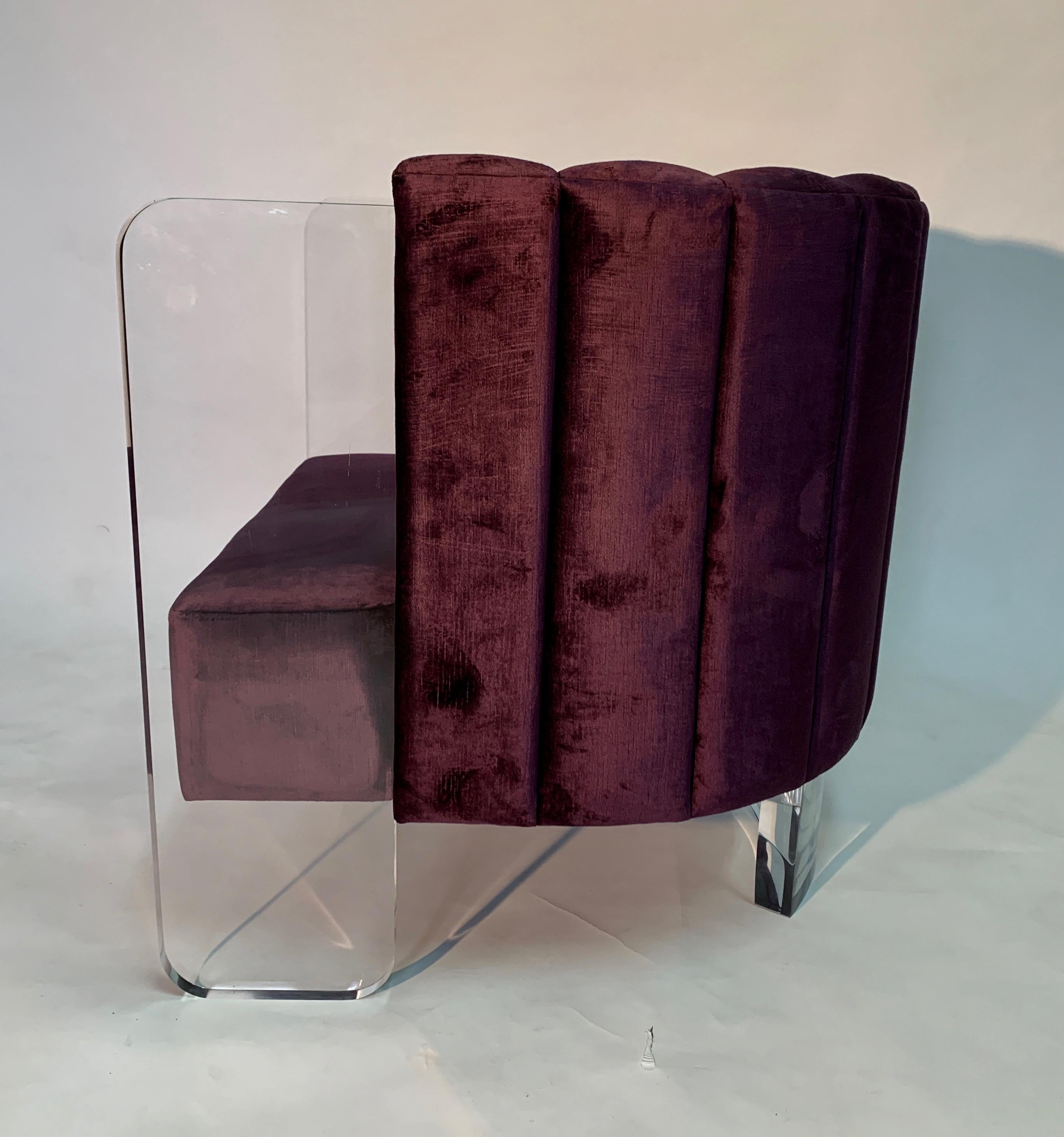 Jonathan Franc's Zebra chair is plush and fully upholstered,. Featuring a channel tufted back cushion and exterior. This lounge chair has clear acrylic arms and a curved acrylic back leg. The fabric is a Purple Velvet. Seat height 16 1/2