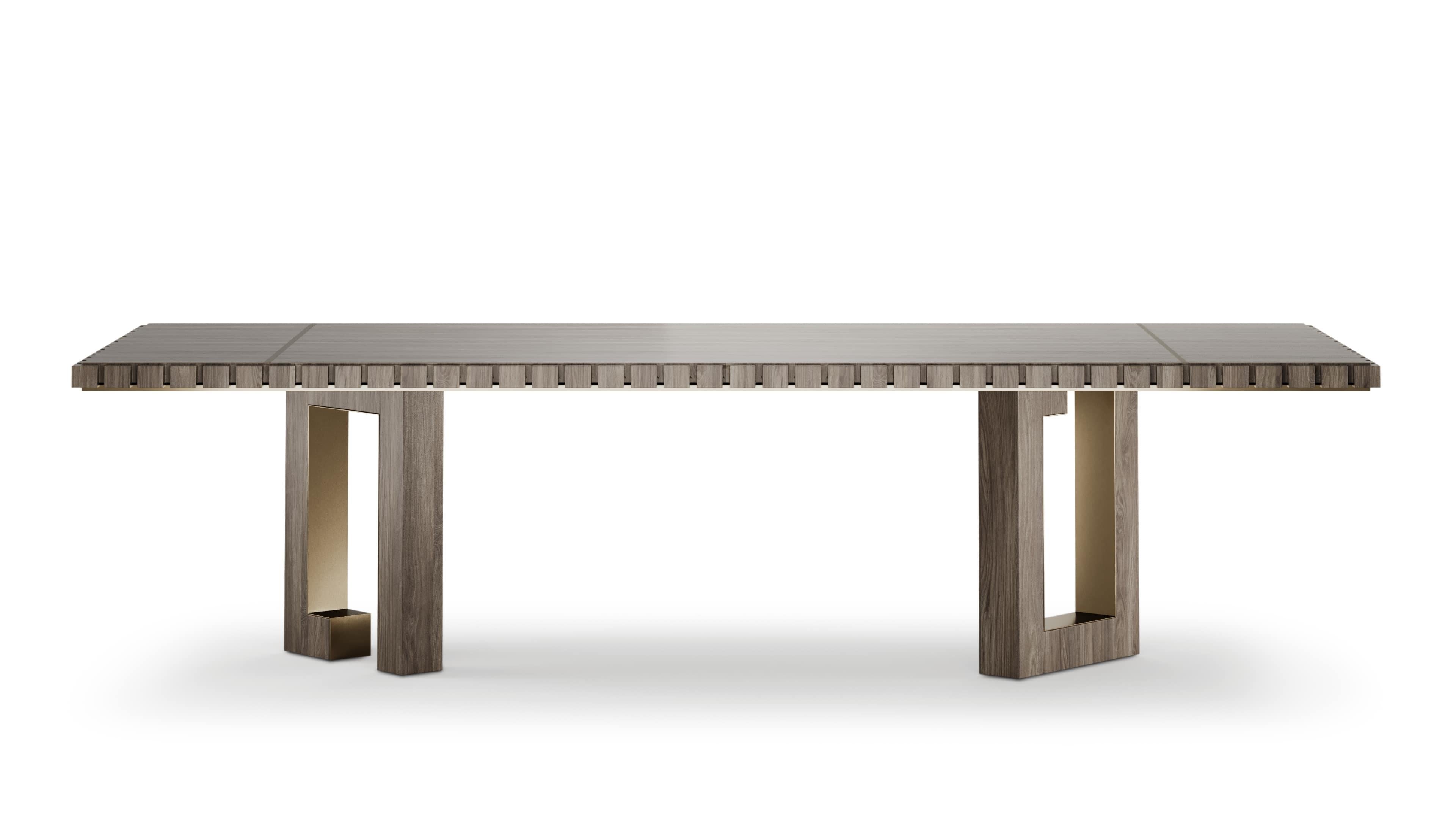 An eye-catching dining table designed with a square-patterned edge that enhances its modern aesthetic. The asymmetrical legs provide a unique structural element, giving the table a contemporary edge. Accentuated with brushed brass details on the