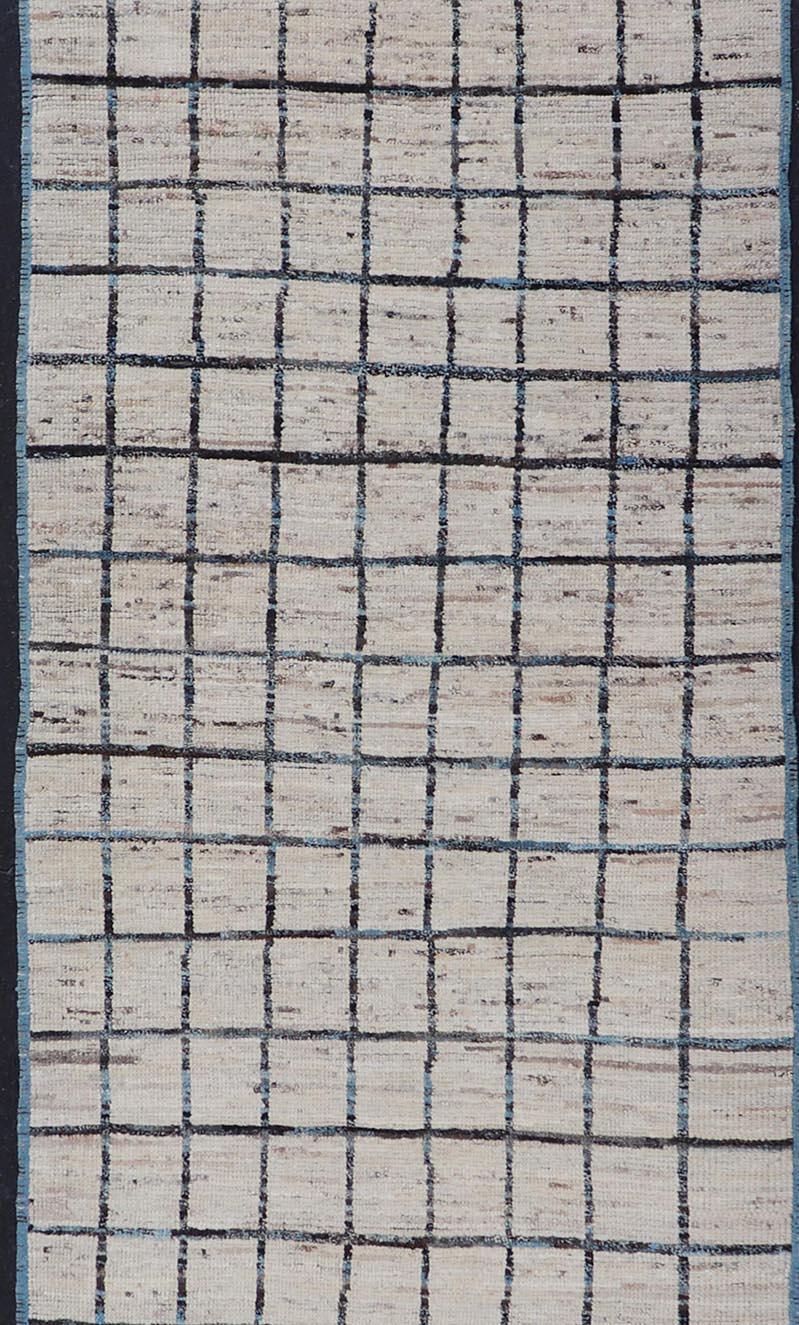 This modern casual tribal rug has been hand-knotted. The rug features a modern geometric box design, rendered in blue and earthy tones; making this rug a superb fit for a variety of classic, modern, casual and minimalist interiors.

Modern Casual