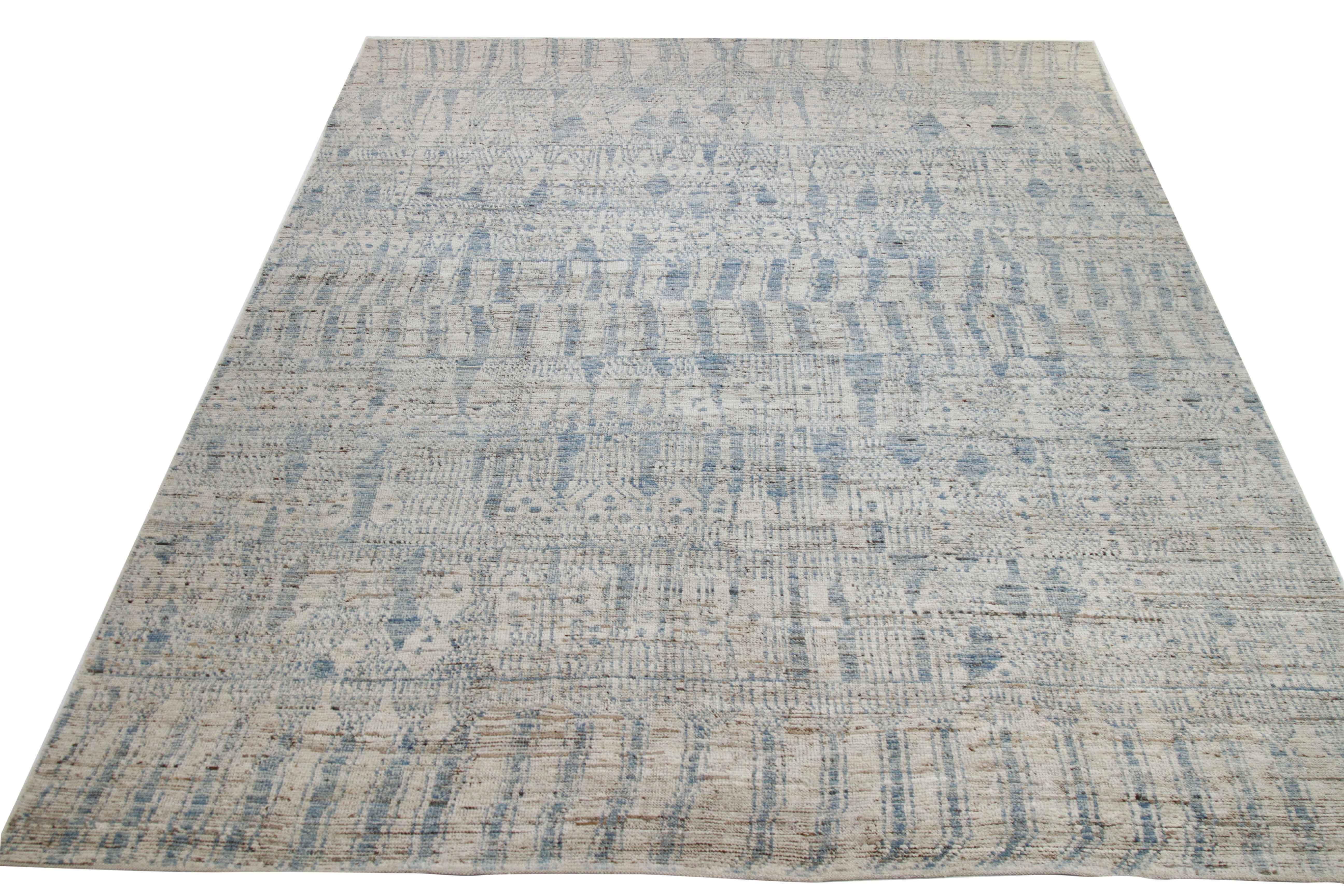 Modern Afghan rug handwoven from the finest sheep’s wool and colored with all-natural vegetable dyes that are safe for humans and pets. It’s a traditional Afghan weaving featuring a Moroccan inspired design highlighted by a mix of blue tribal
