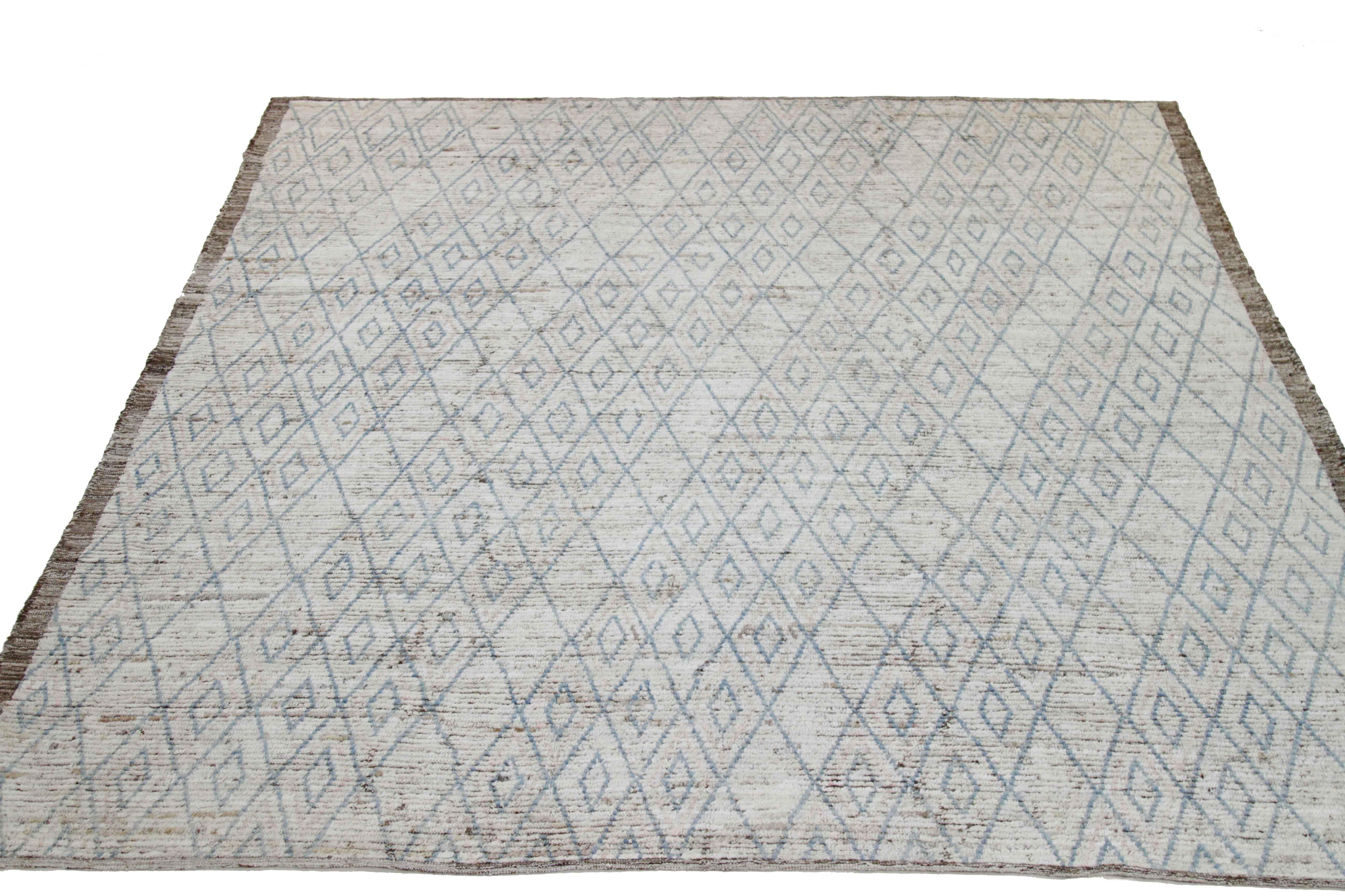 Modern Afghan rug handwoven from the finest sheep’s wool and colored with all-natural vegetable dyes that are safe for humans and pets. It’s a traditional Afghan weaving featuring a Moroccan inspired design highlighted by blue tribal diamond details
