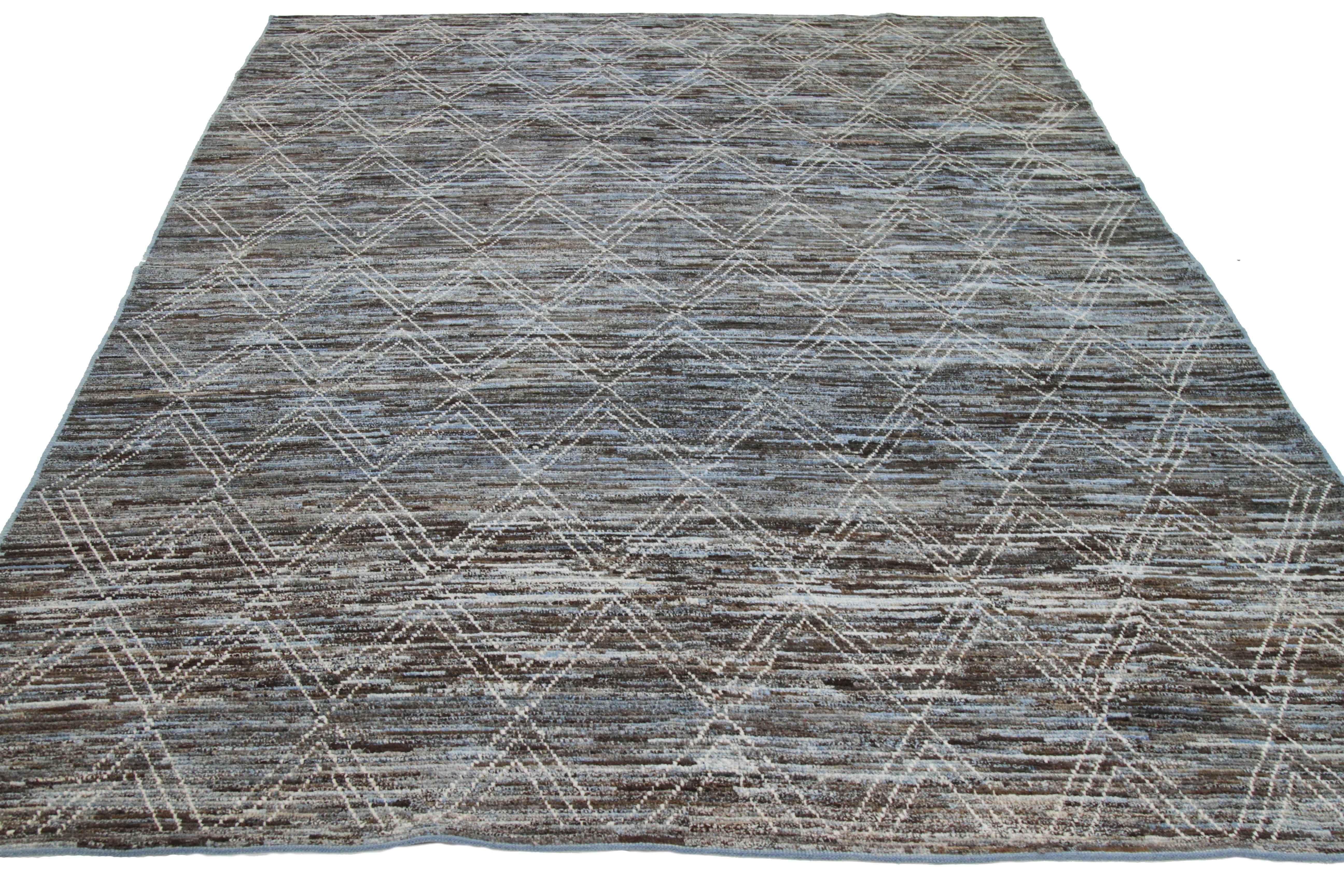 Modern Afghan rug handwoven from the finest sheep’s wool and colored with all-natural vegetable dyes that are safe for humans and pets. It’s a traditional Afghan weaving featuring a Moroccan inspired design highlighted by ivory diamonds over a blue