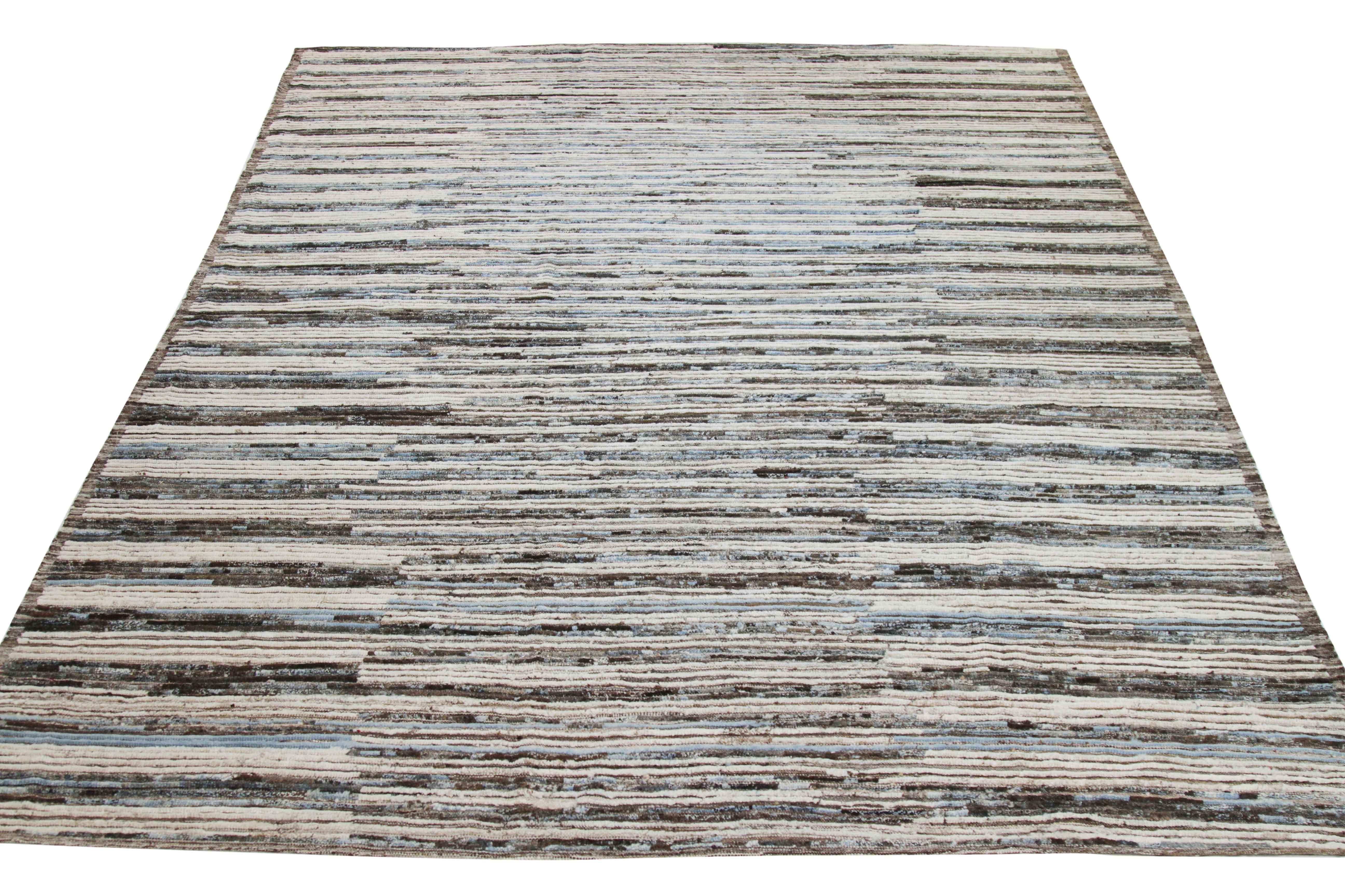 Modern Afghan rug handwoven from the finest sheep’s wool and colored with all-natural vegetable dyes that are safe for humans and pets. It’s a traditional Afghan weaving featuring a Moroccan inspired design highlighted by sky blue and brown streaks