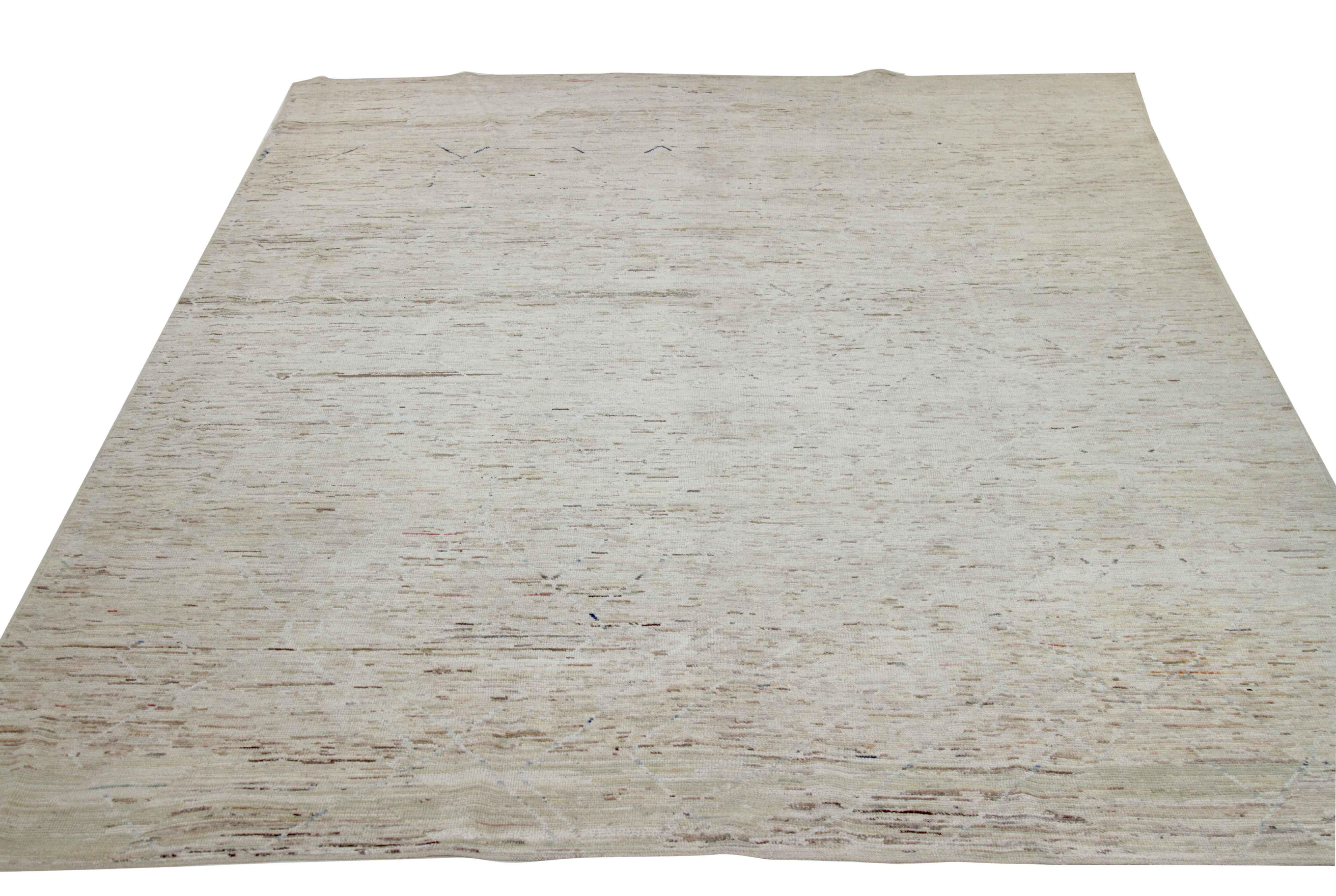 Modern Afghan rug handwoven from the finest sheep’s wool. It’s colored with all-natural vegetable dyes that are safe for humans and pets. This piece is a traditional Afghan weaving featuring a Moroccan inspired design. It’s highlighted by white and