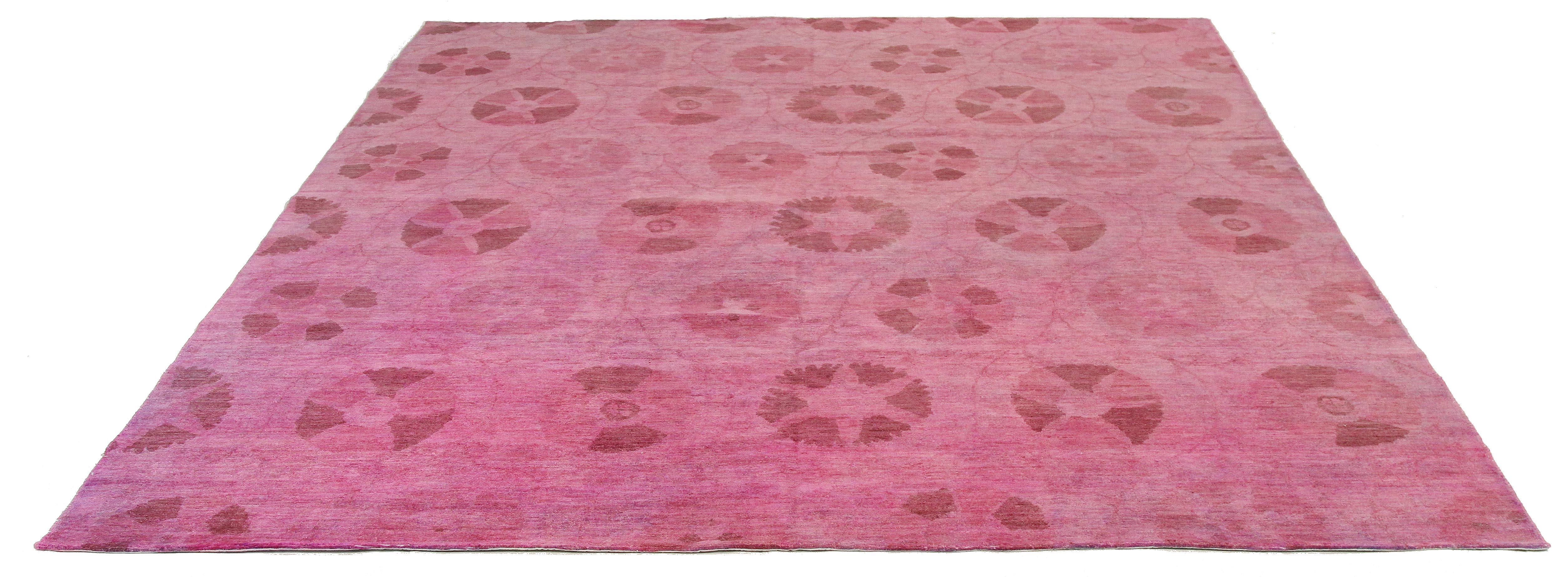 Afghan rug handwoven from the finest sheep’s wool and colored with all-natural vegetable dyes that are safe for humans and pets. It’s a contemporary Afghan design featuring lovely botanical patterns of brown and overdyed with pink and purple hues.