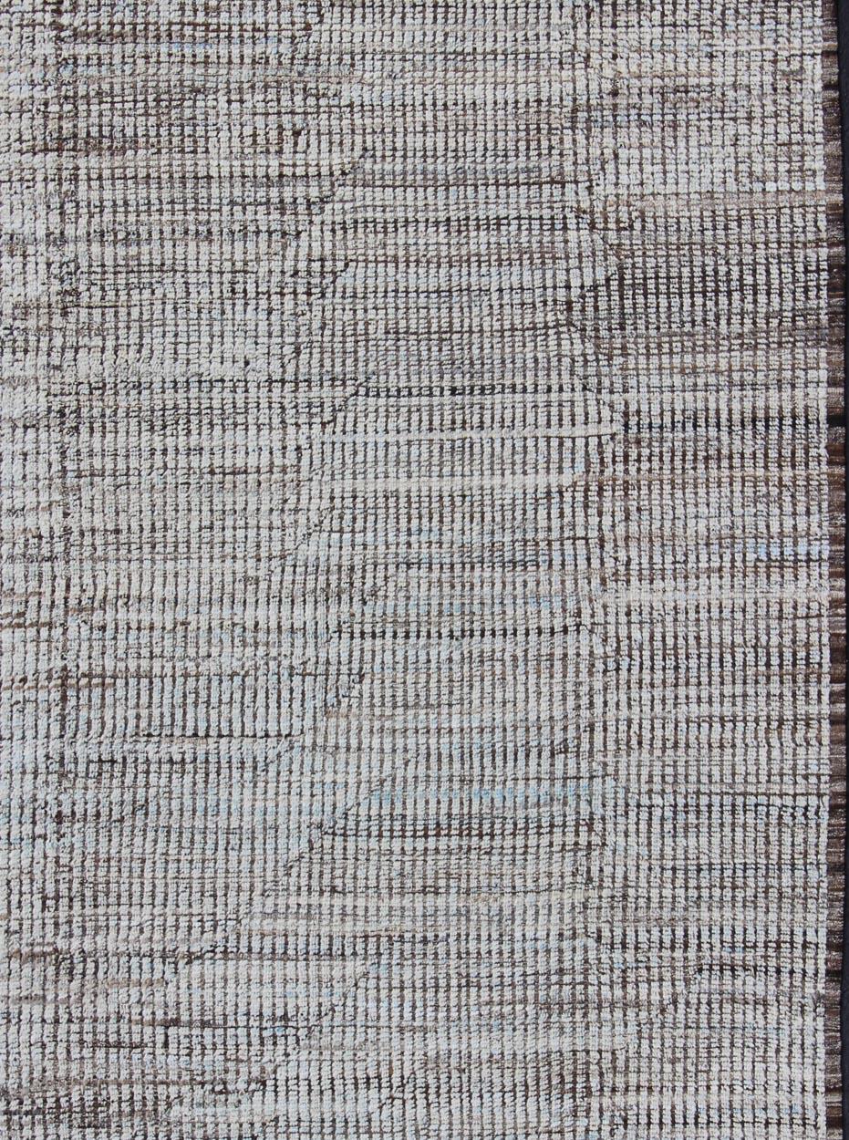 Neutral tone rug with Moroccan free-flowing tribal design. Keivan Woven Arts / rug AFG-29249, country of origin / type: Afghanistan / Modern
Measures: 9 x 11'8.
The subdued design of this piled rug makes it perfect for modern and casual interiors
