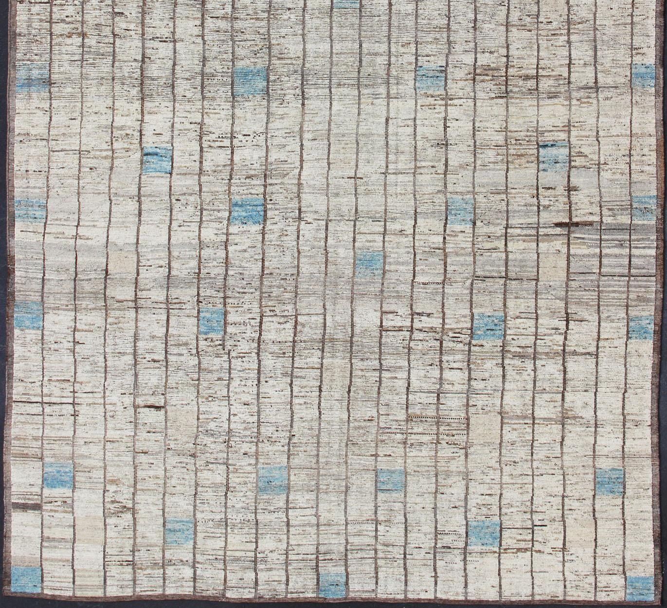 Modern Afghanistan Rug in Neutral Tones with Subdued Design with Pops of Blue In New Condition For Sale In Atlanta, GA
