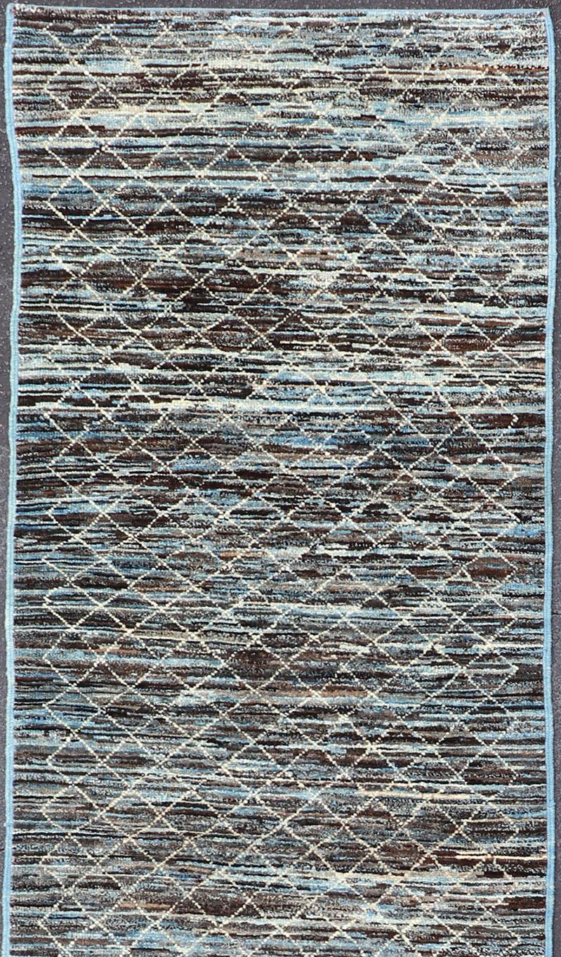 Blue and Brown tone rug with Moroccan free-flowing tribal design, Keivan Woven Arts / rug AFG-30667, country of origin / type: Afghanistan 

The subdued design of this piled rug makes it perfect for modern and casual interiors alike. The neutral