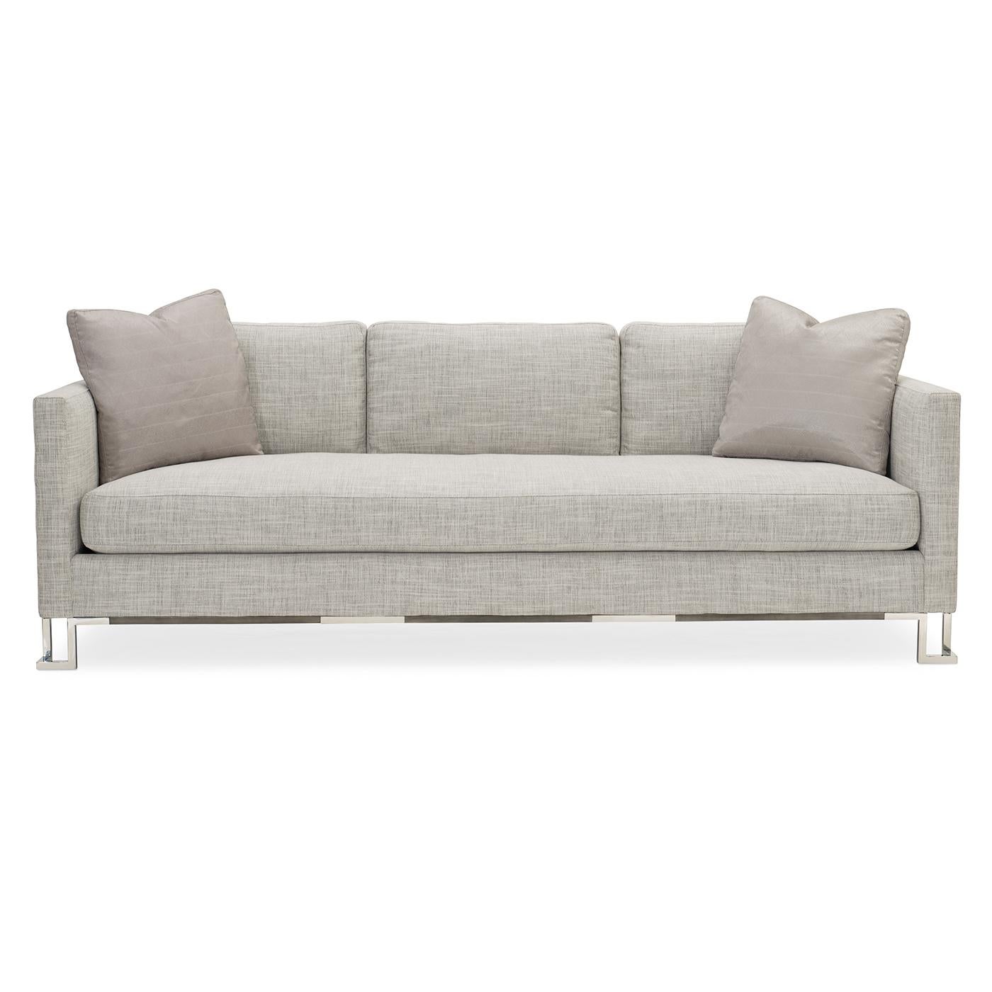 A definitive tastemaker, this exceptional sofa has all the right stuff. Its simple silhouette is accentuated by a stainless-steel and tungsten-plated frame with a two-tone finish. This innovative design gives the sofa a suspended look and creates a