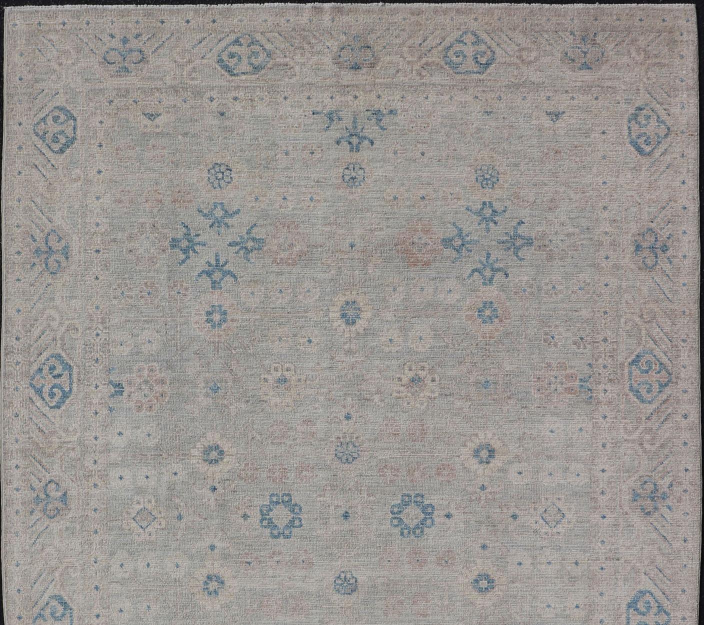 Wool Modern All-Over Modern Khotan Rug with Light Background and Blue Colors For Sale