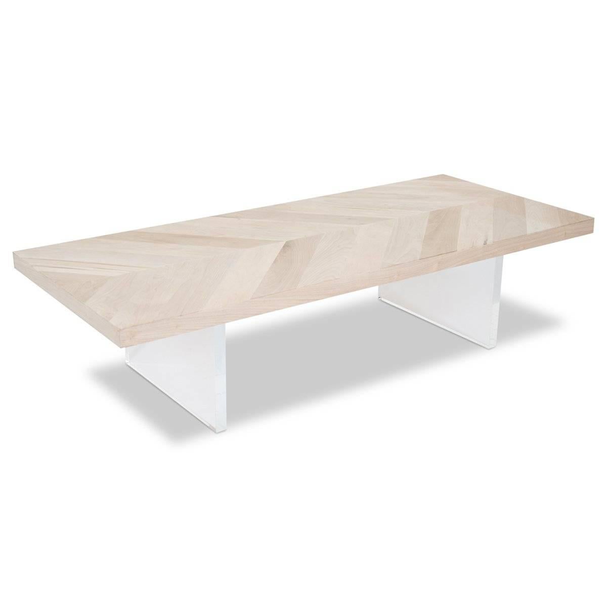 This beautifully hand-crafted coffee table is sure to impress. Featuring a beautiful bleached walnut laid out in a herringbone pattern and supported by two plinth Lucite legs.

Dimensions:
60