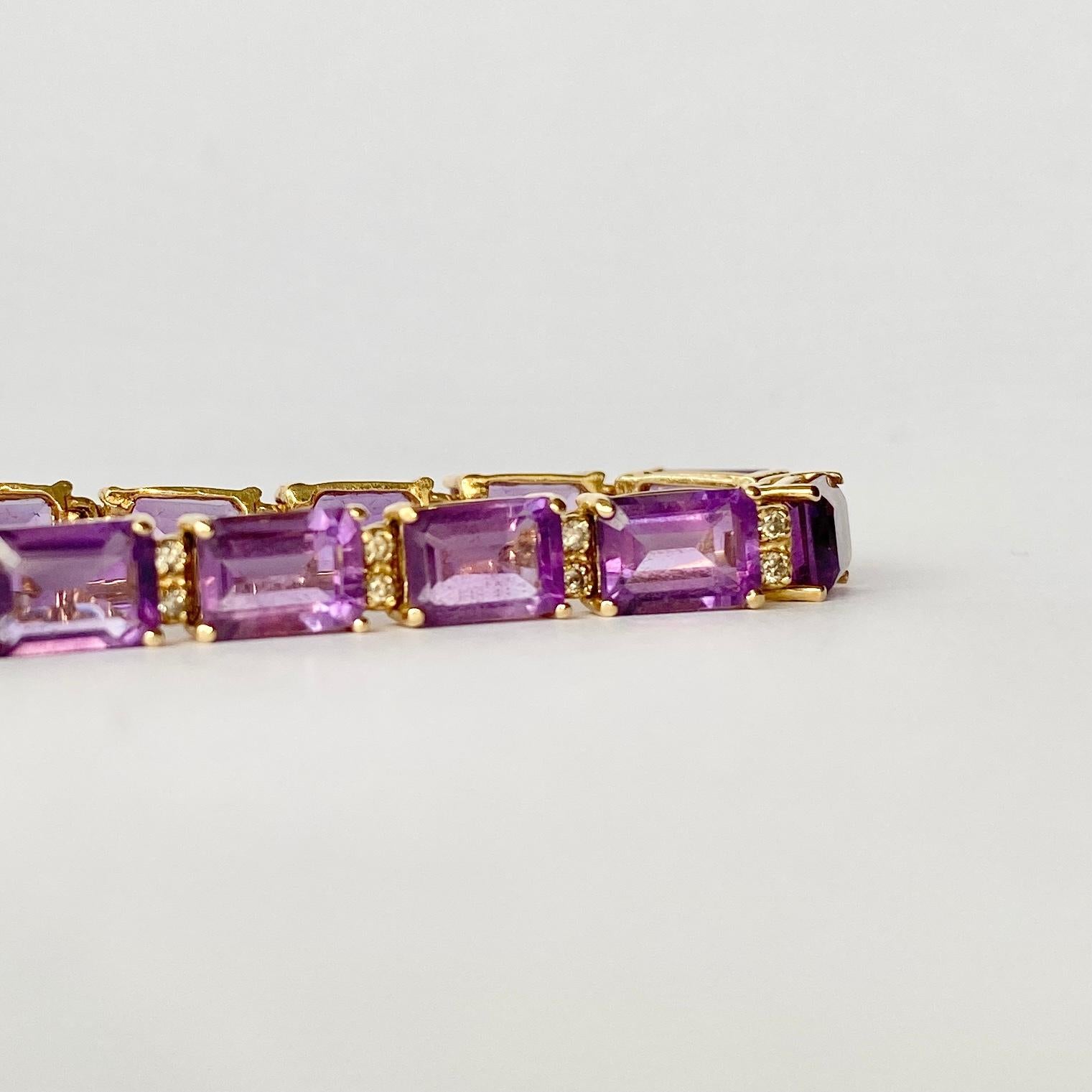 The stones in this bracelet are a gorgeously rich purple colour. They are set in simple claw settings and in-between each amethyst there are a pair of diamond points. The Dimond total of this bracelet is 40pts.

Length: 17.6cm
Stone Dimensions: