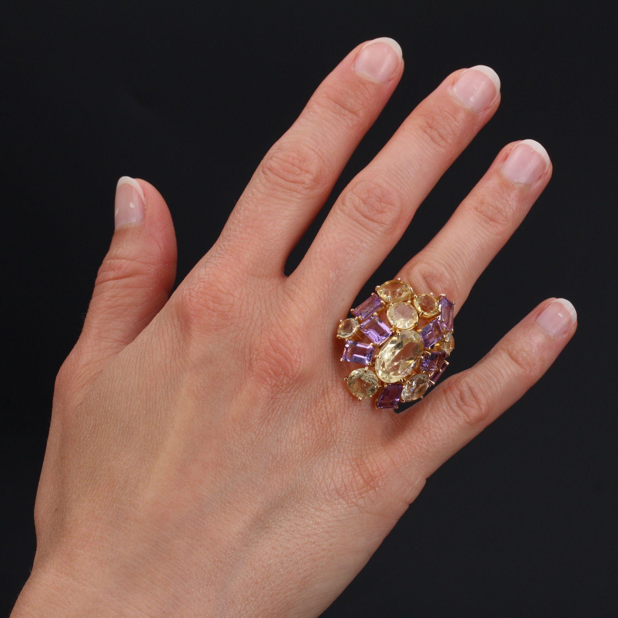 Ring in 18 karat yellow gold.
Of oval and curved form, this cocktail ring is paved of citrines, amethysts and of aquamarine, round, oval and with degrees cut, all set with claws.
Total weight of amethysts : 6.10 carats approximately.
Total weight of